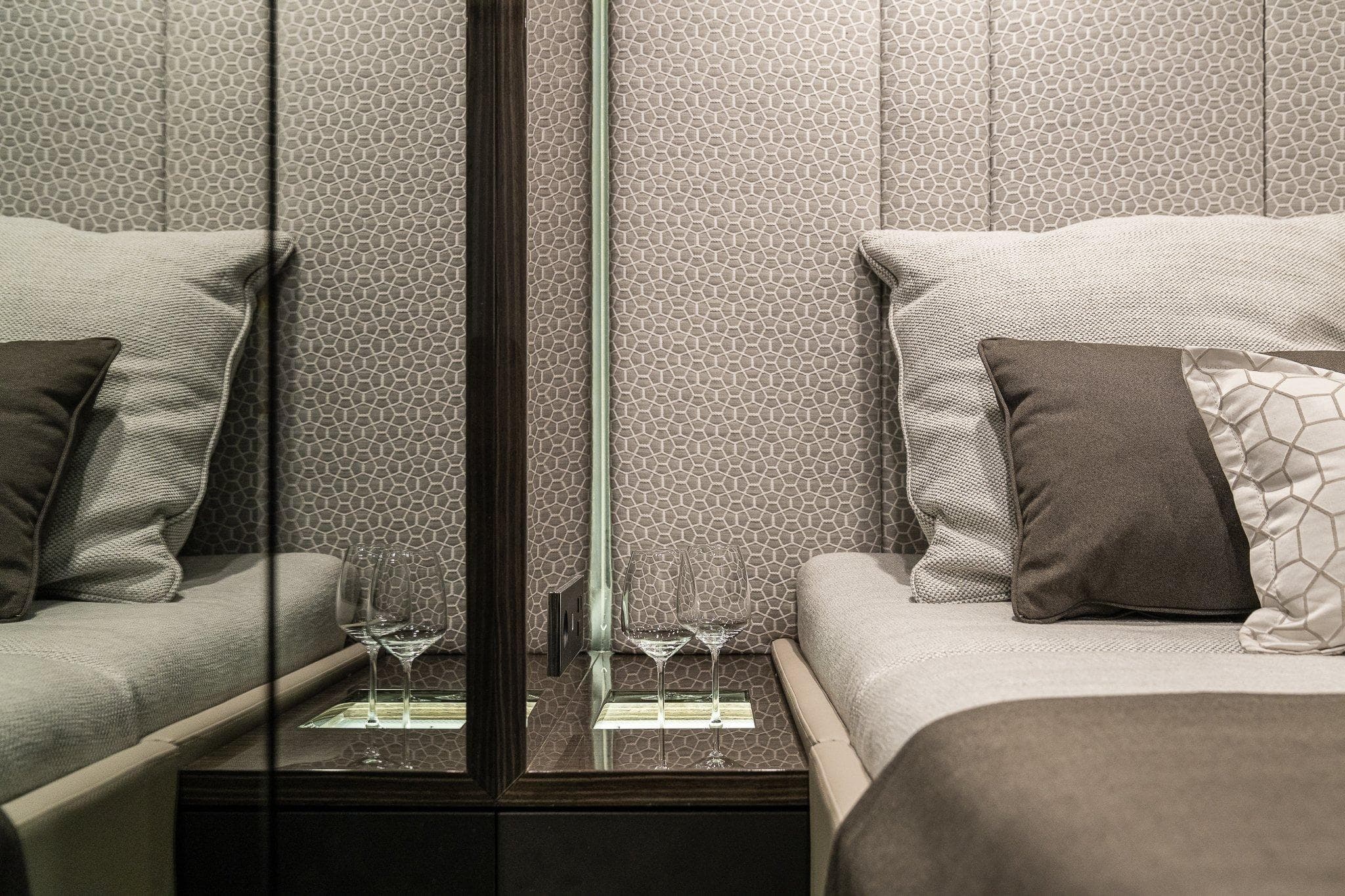 Luxurious interior of 2026 Sunreef 70 yacht with elegant bedding and decor.