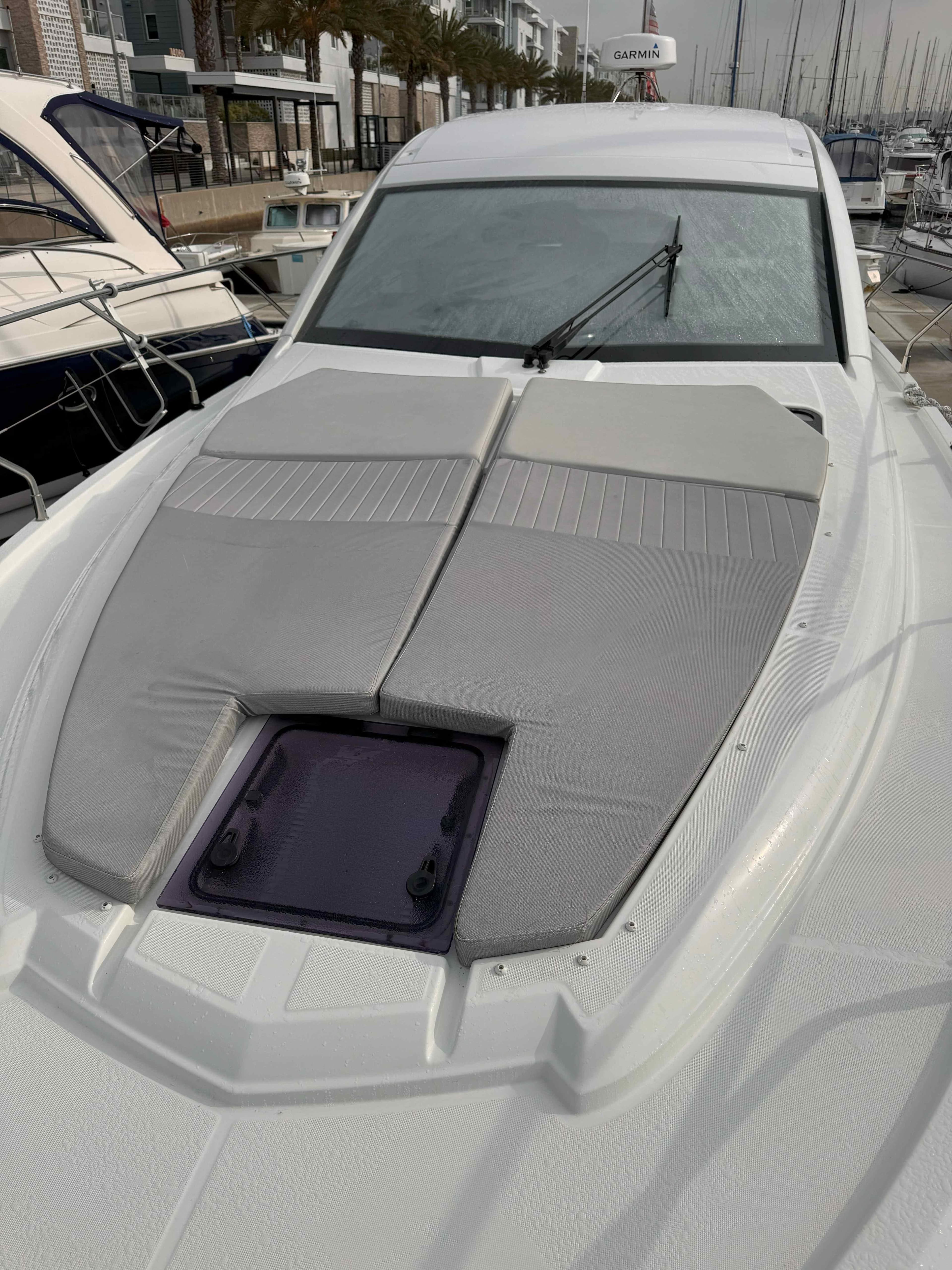 2021 Beneteau Gran Turismo 40 yacht with sunbathing cushions on deck.
