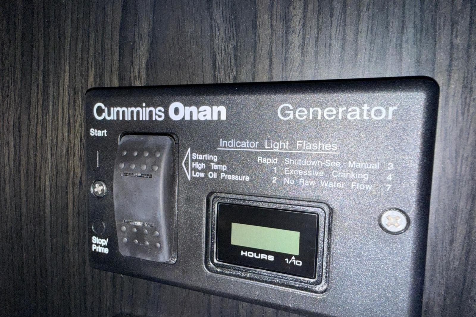Cummins Onan generator control panel on 2023 Schaefer 400 Sport boat.