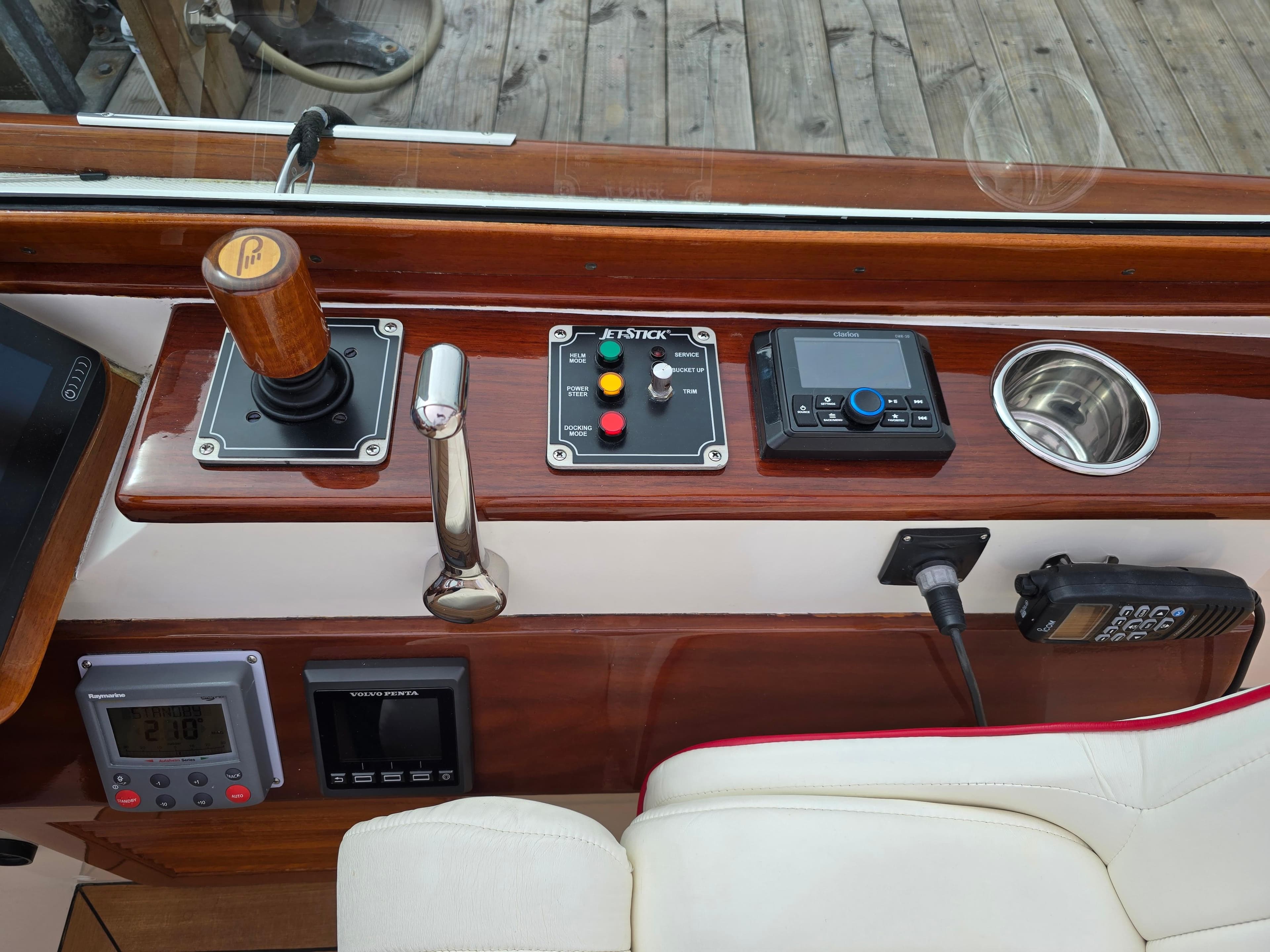 Control panel of a 2007 Hinckley Talaria 29 R boat with joystick and navigation equipment.
