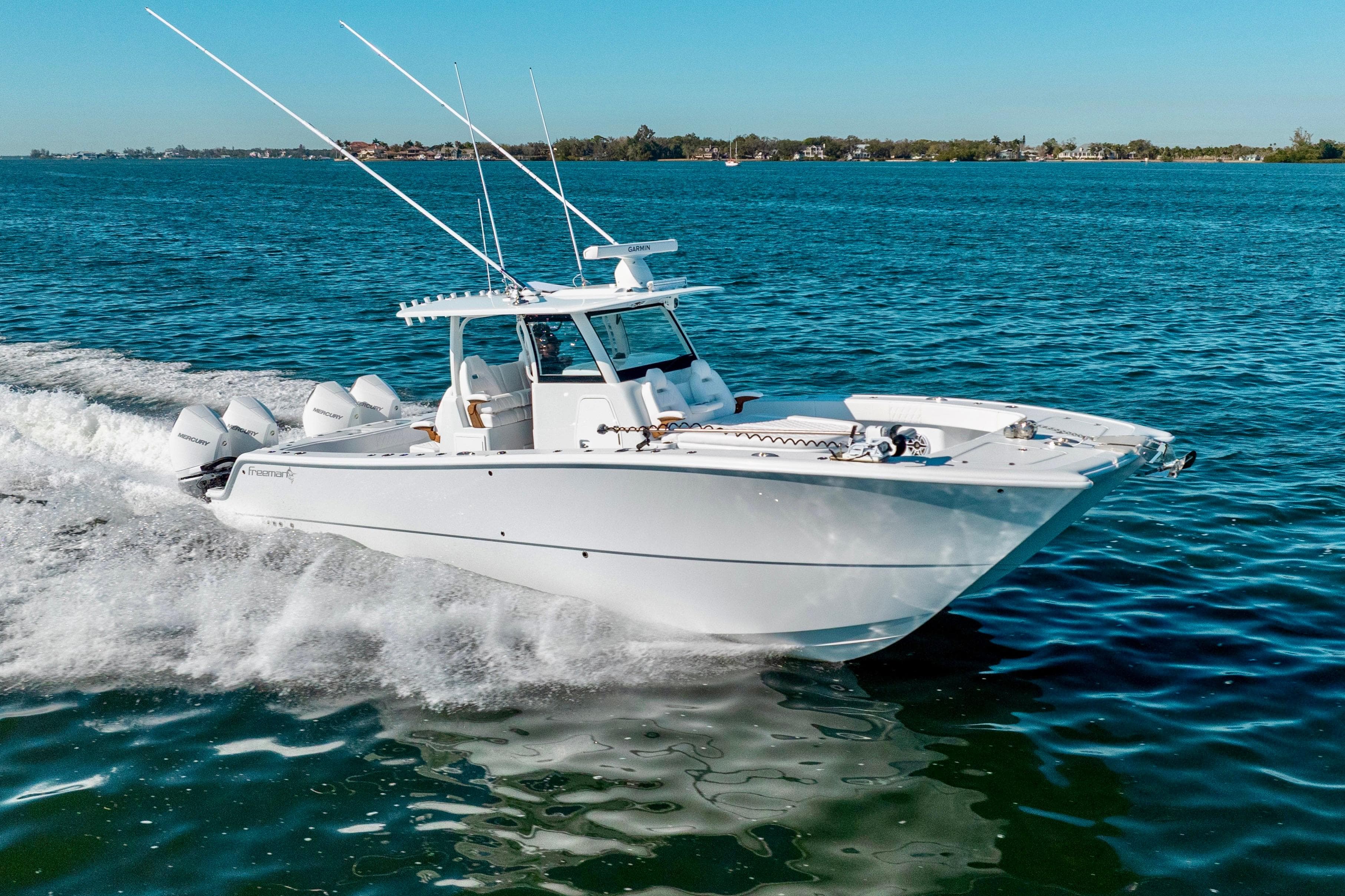 2026 Freeman 35 boat cruising on open water under clear blue skies.