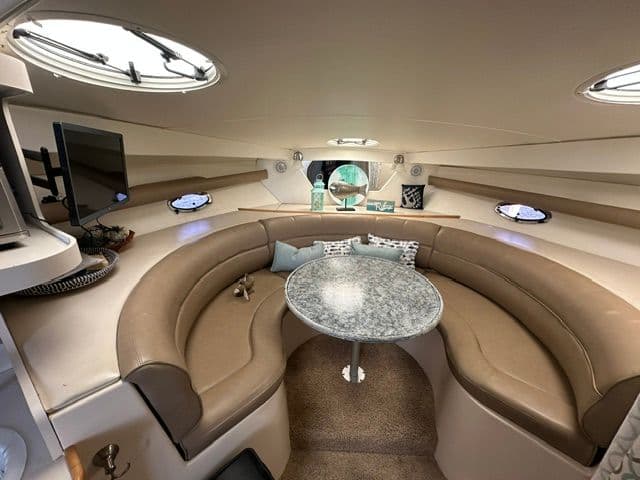 Interior of a 1995 Cruisers Yachts 3570 with cozy seating area.