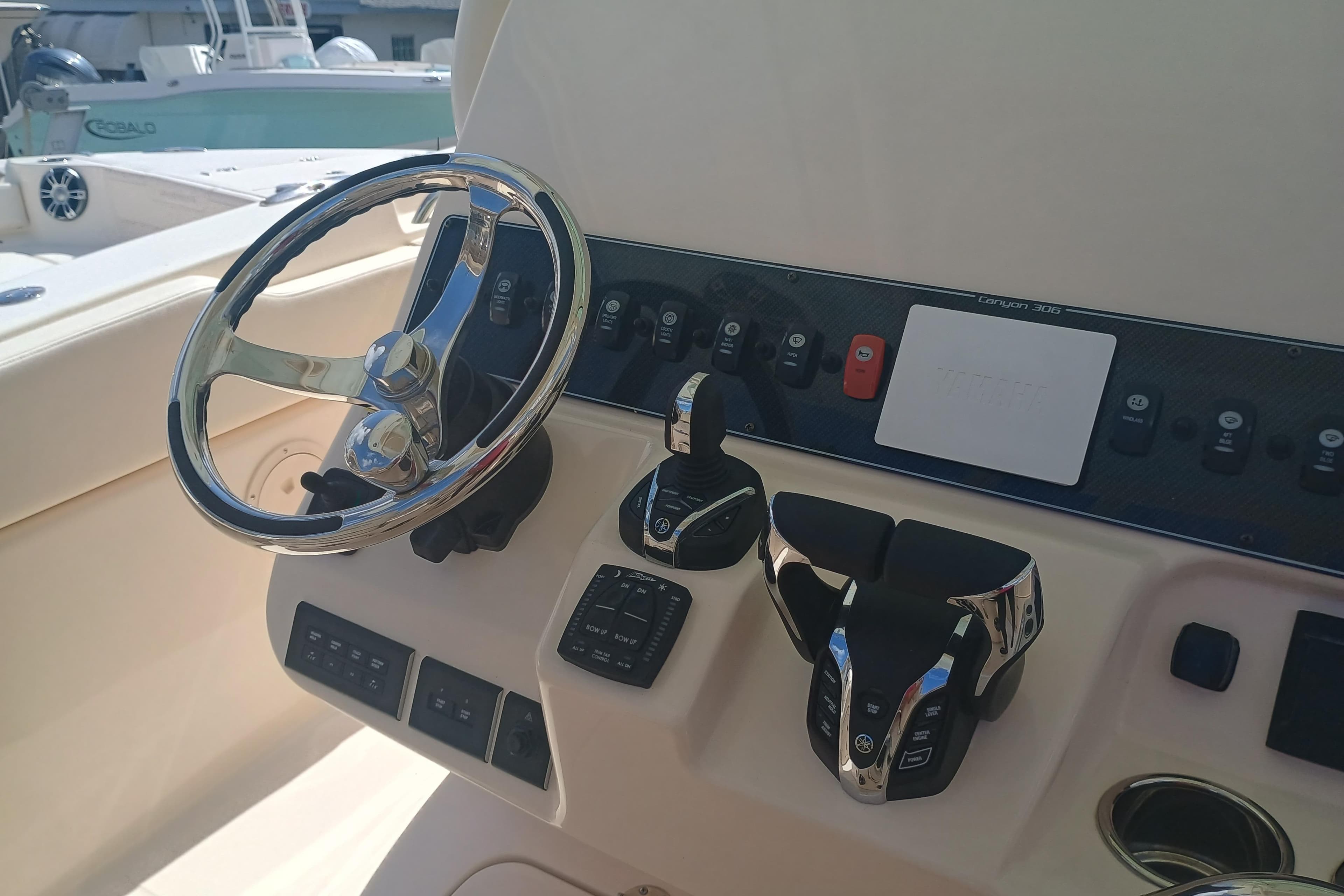 2025 Grady-White Canyon 306 boat dashboard with steering wheel and controls.