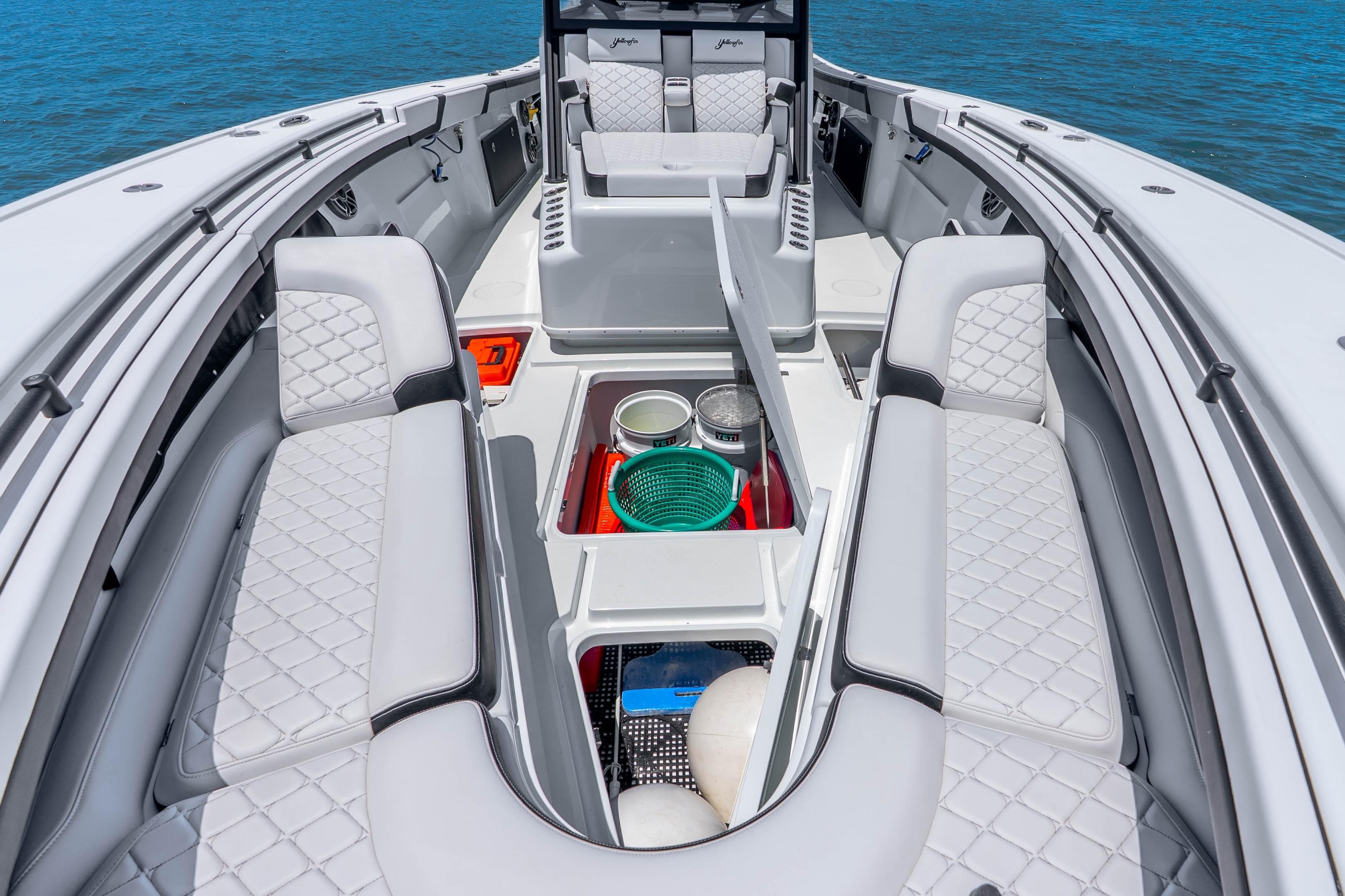 2024 Yellowfin 42 Offshore boat interior with quilted seating and storage compartments.