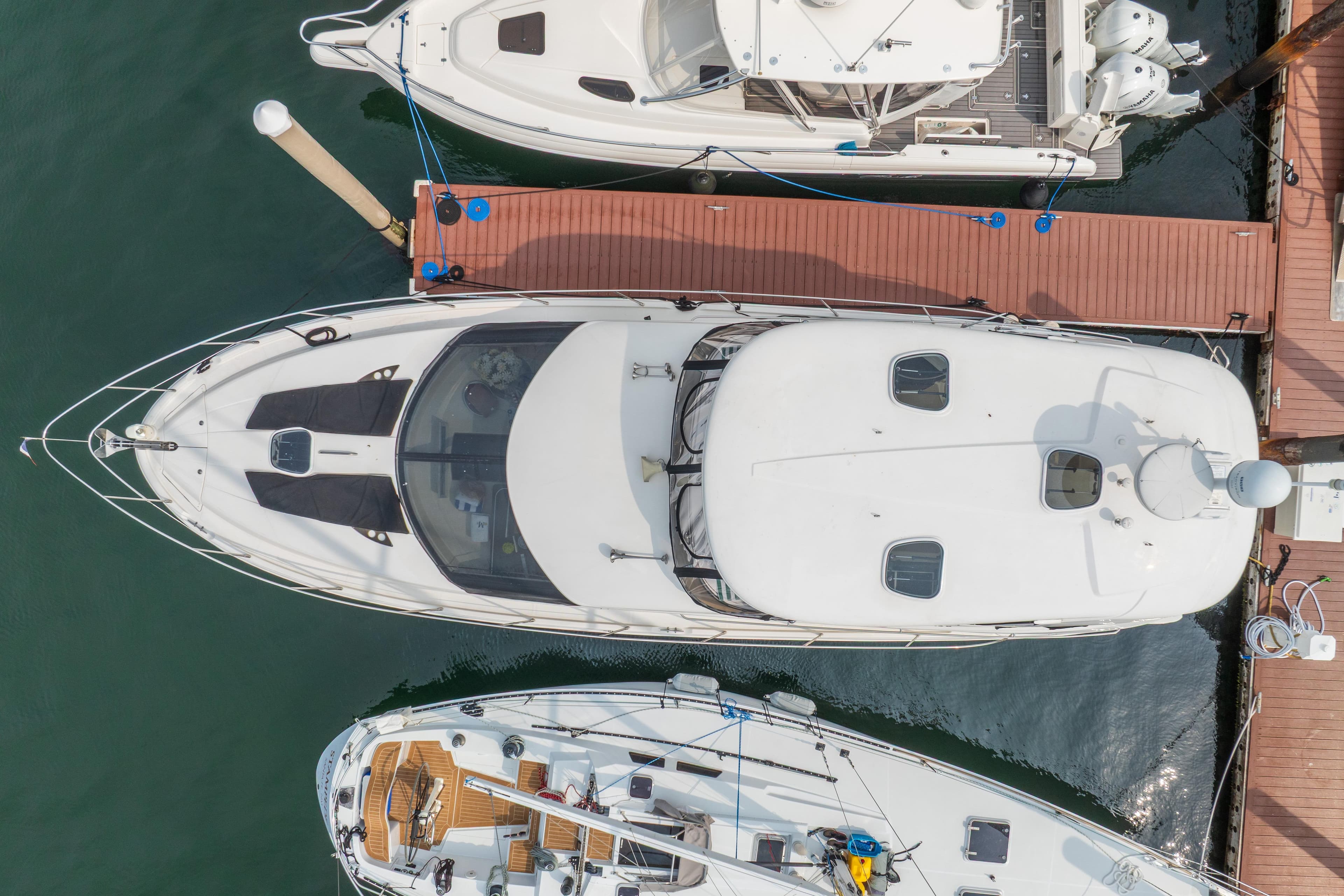 Aerial view of 2009 Meridian 441 Sedan yacht docked at marina.