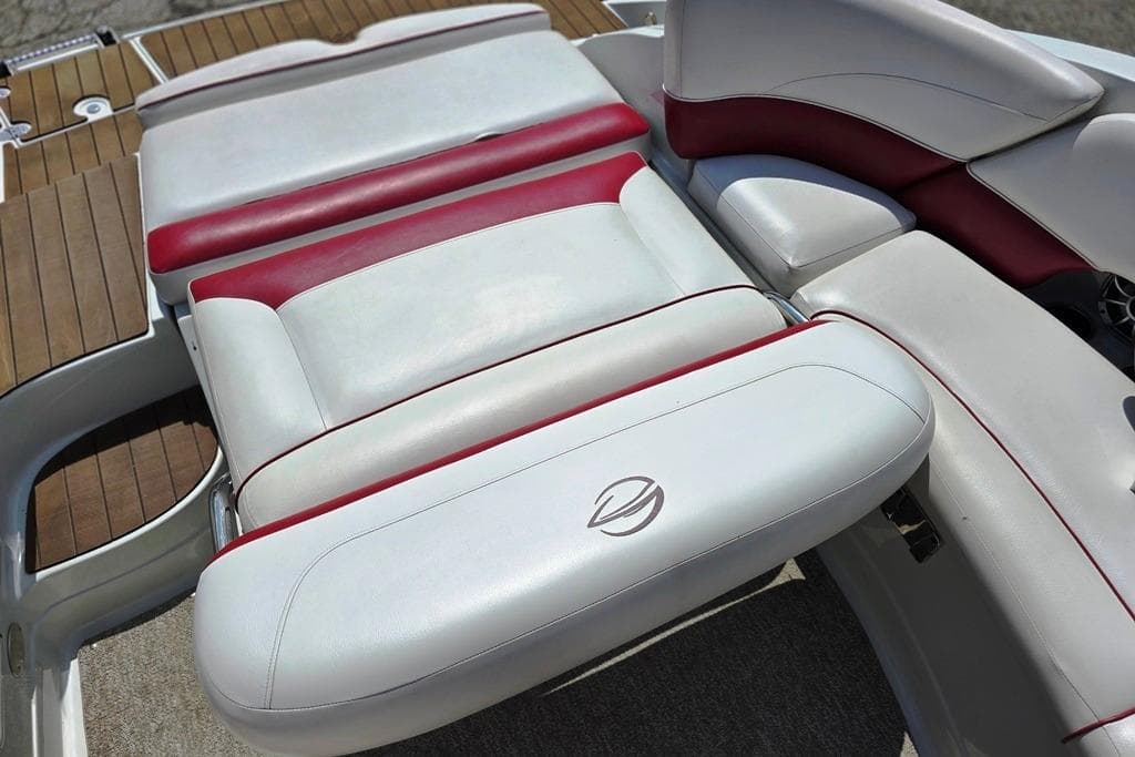 2012 Crownline Eclipse E4 boat interior with white and red cushioned seating.