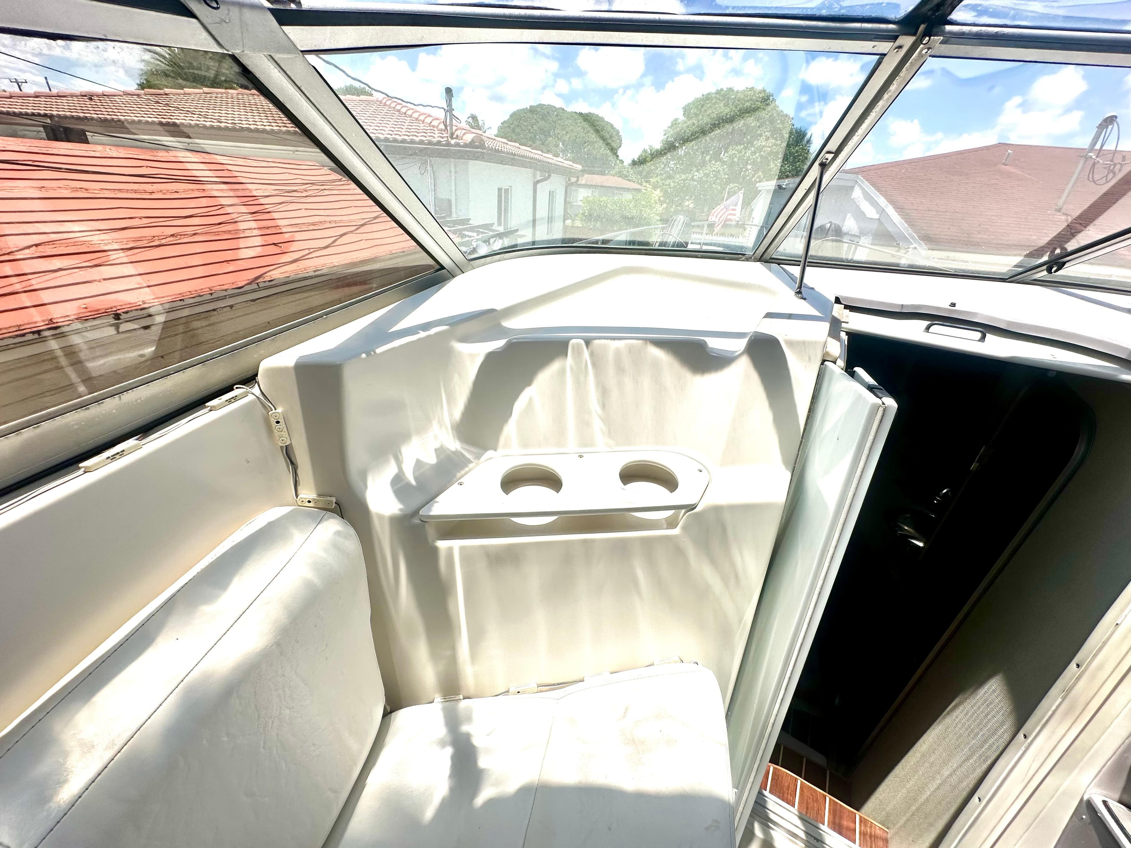 2001 Regal Commodore 2760 boat interior with seating and cup holders.