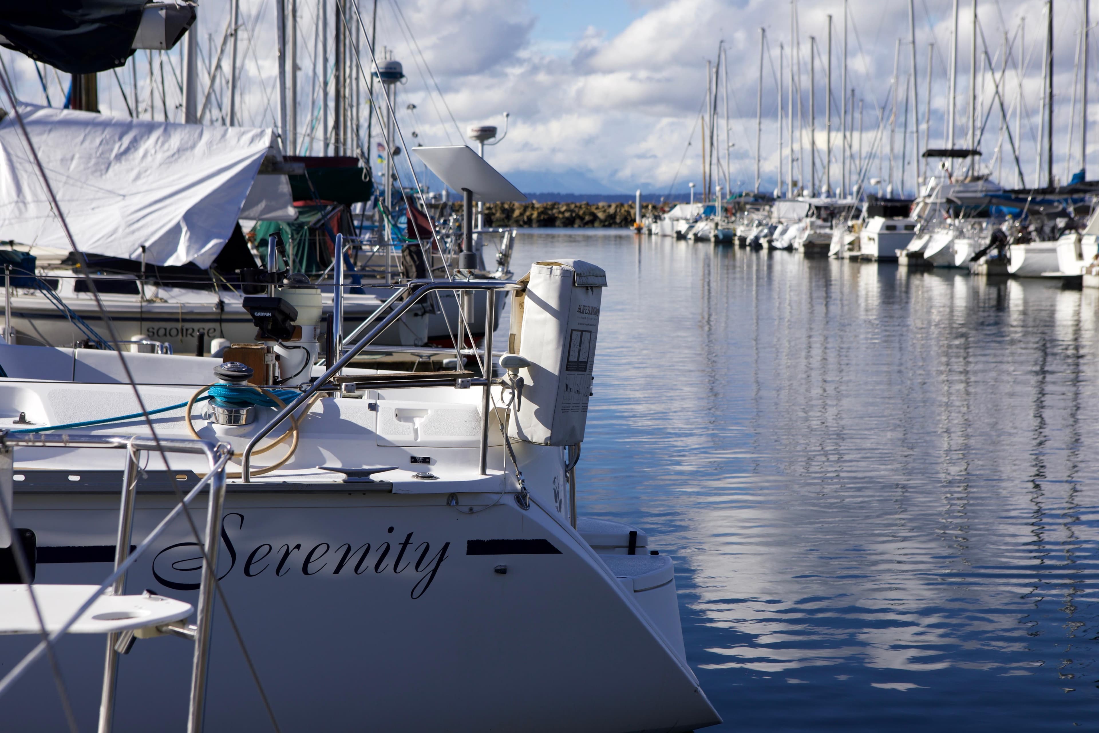 Hunter 33.5 sailboat "Serenity" docked in a marina, calm waters, 1992 model.