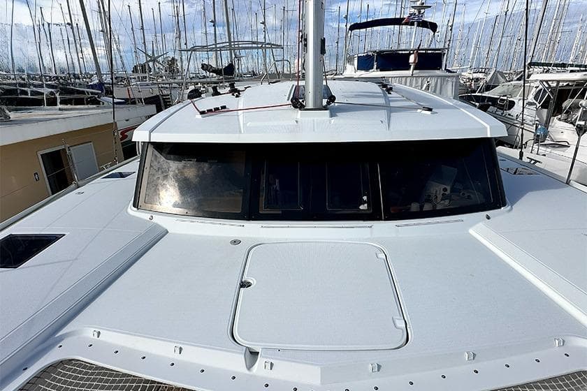 2018 Fountaine Pajot Lucia 40 catamaran docked in a marina, showcasing sleek design.