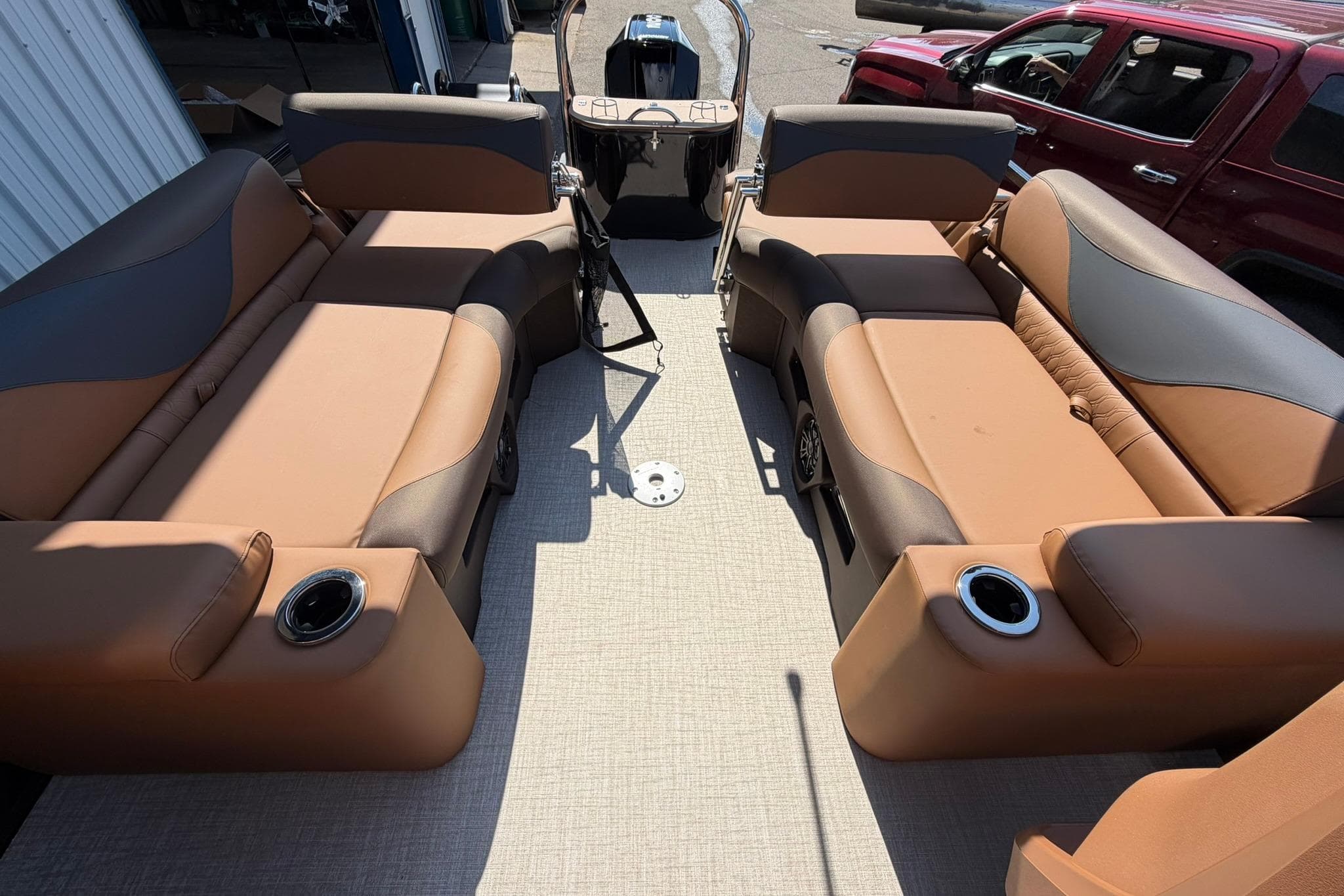 2026 Avalon LSZ Quad Lounge Shift boat interior with tan and brown seating.