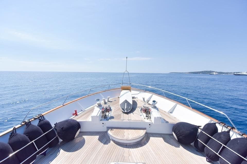Bow view of 1984 W.A. Souter & Sons 34 yacht on calm blue sea.