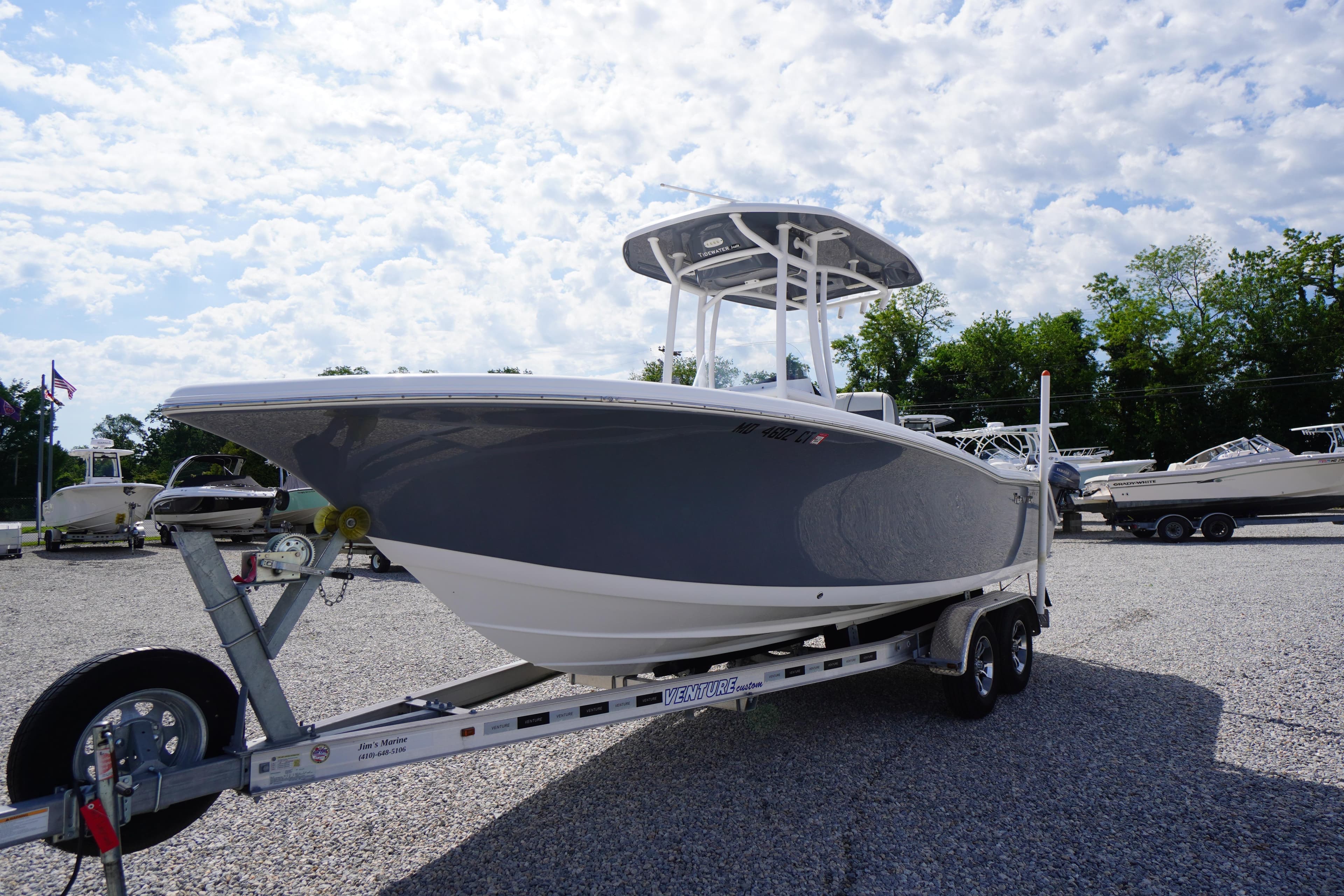 2020 Tidewater 220 LXF boat on trailer under a partly cloudy sky.