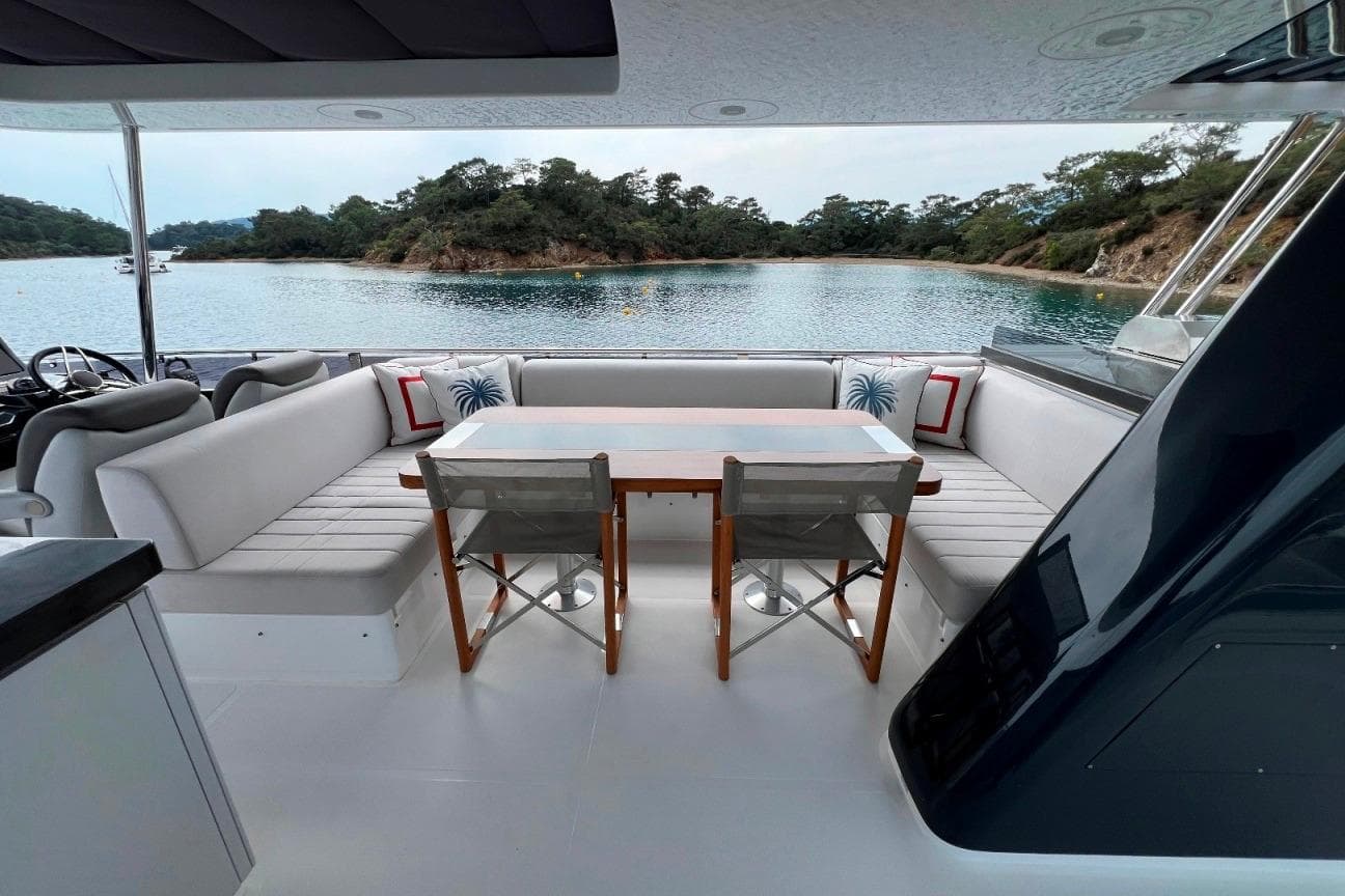 Luxurious 2024 Sirena 68 yacht interior with elegant seating and scenic ocean view.
