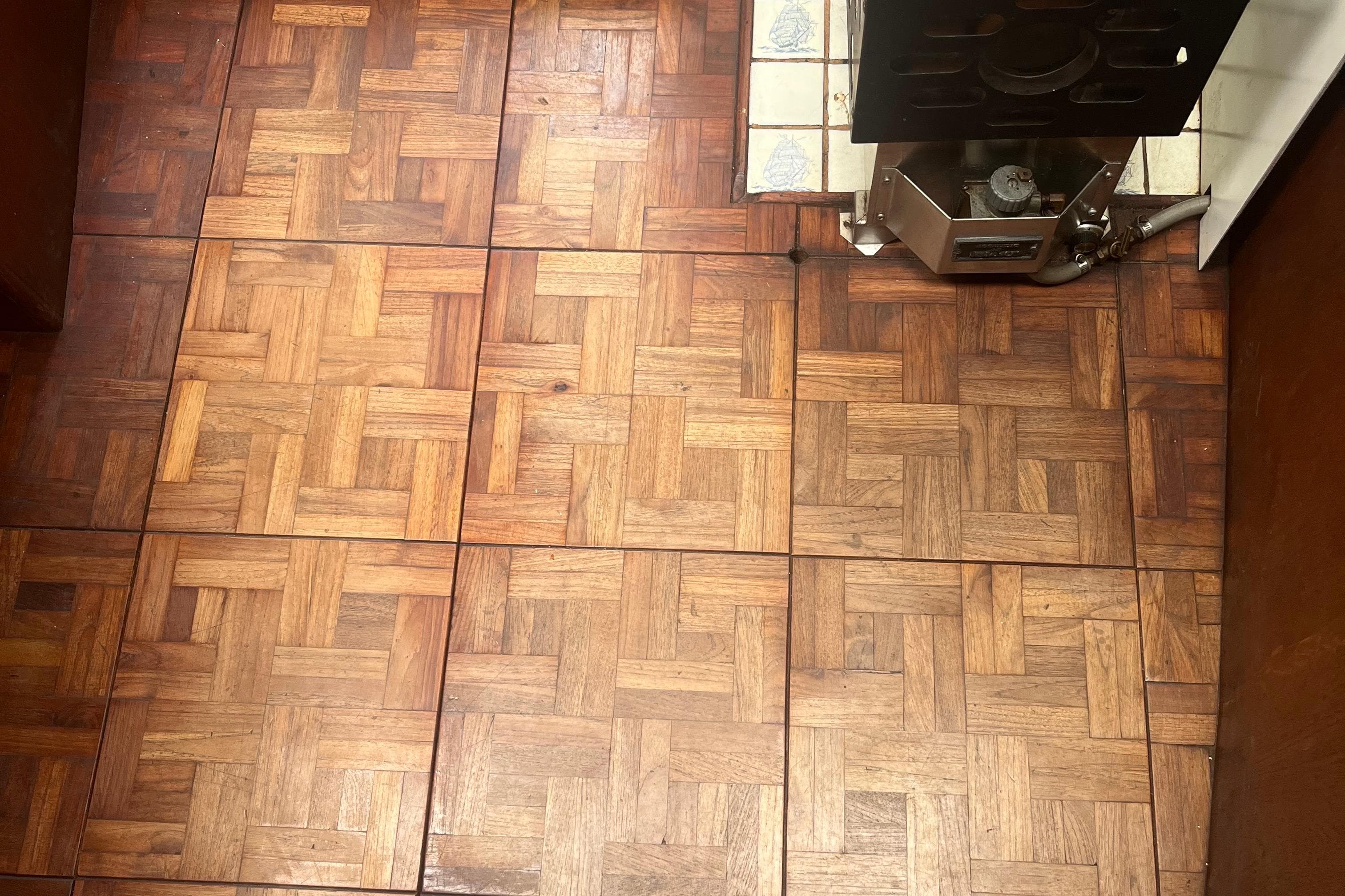 Wooden parquet flooring with a vintage stove, Cooper 353 model, 1981.