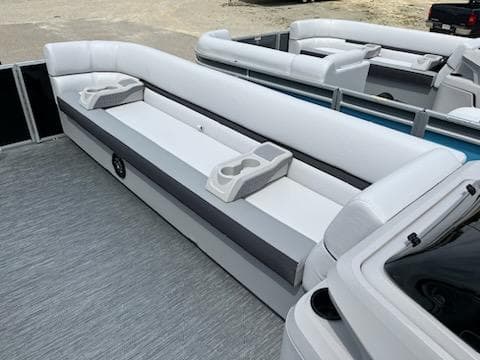 2024 Sweetwater 2286C pontoon boat with white and gray seating.