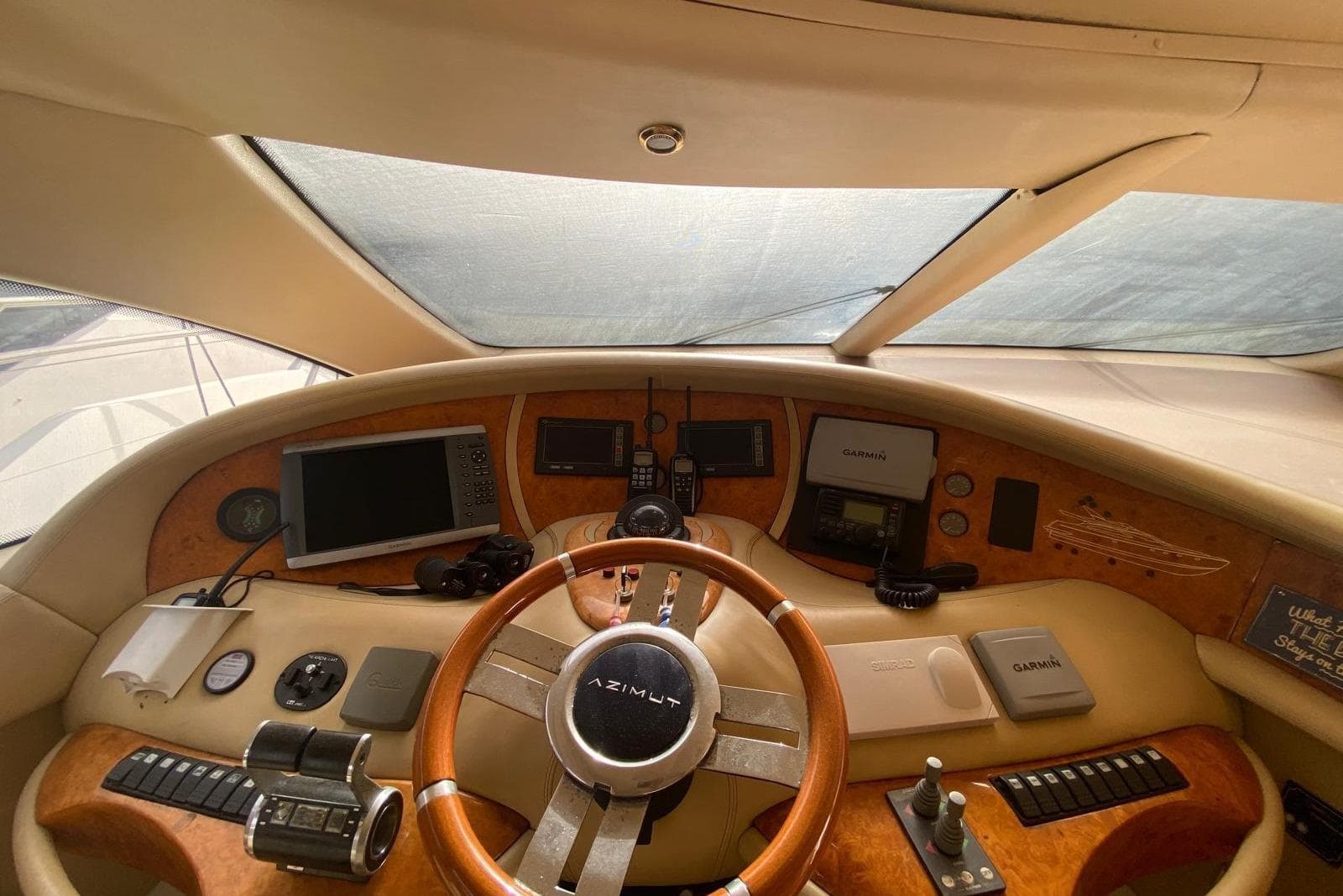 Cockpit of 2006 Azimut 68E yacht with navigation equipment and steering wheel.