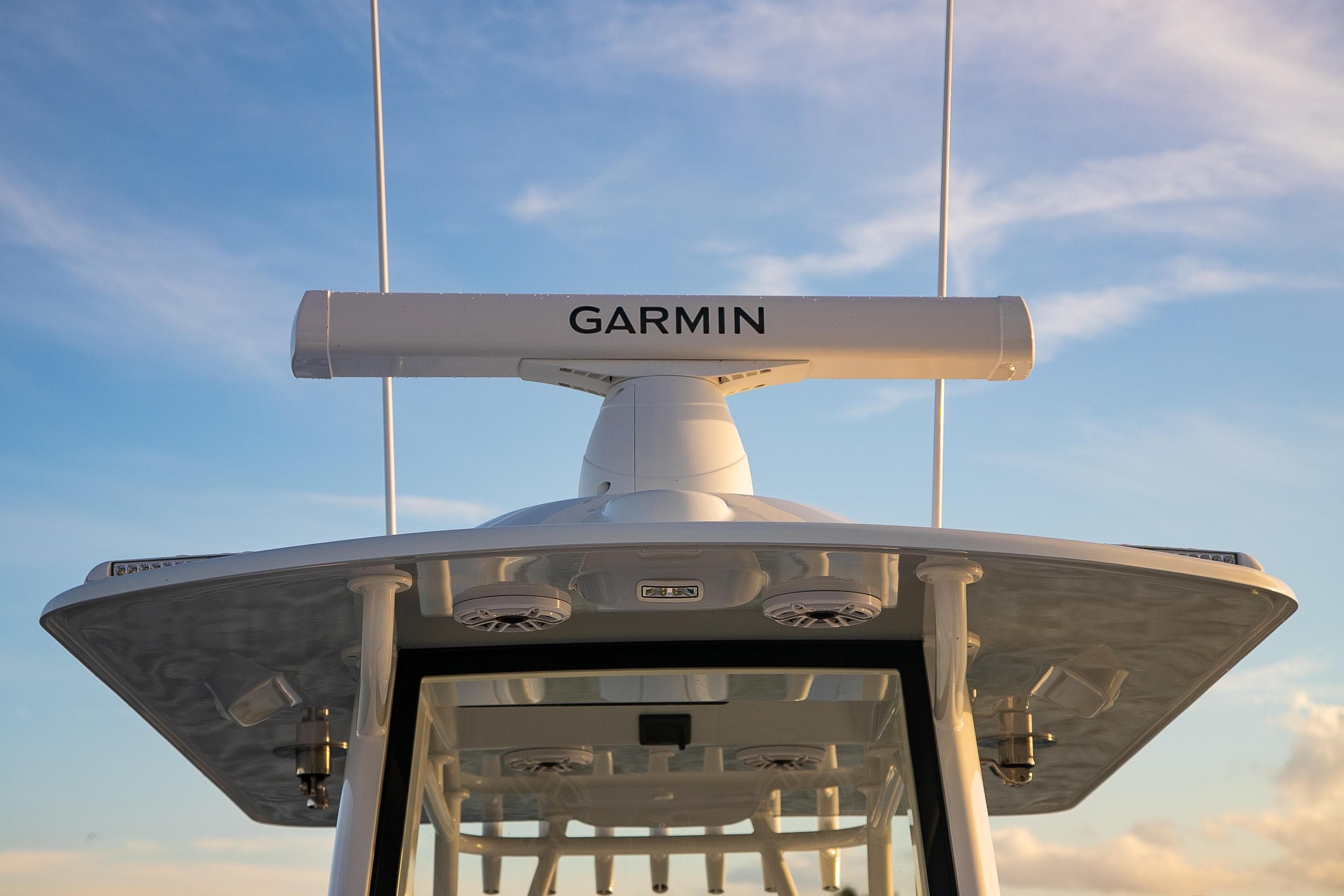 2026 Yellowfin 36 Offshore boat with Garmin radar against blue sky.