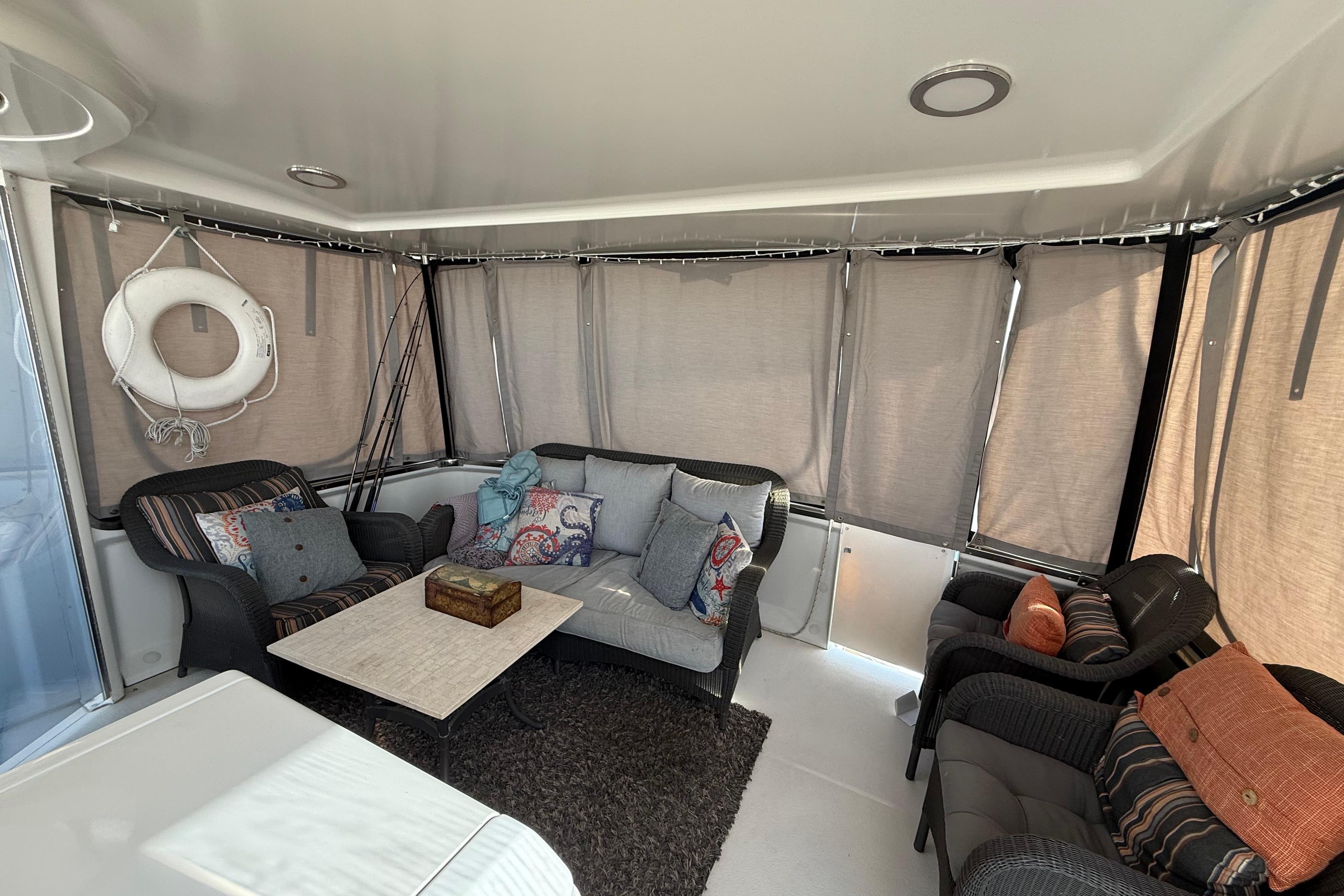 1999 Carver 406 Aft Cabin Motor Yacht interior with cozy seating and nautical decor.
