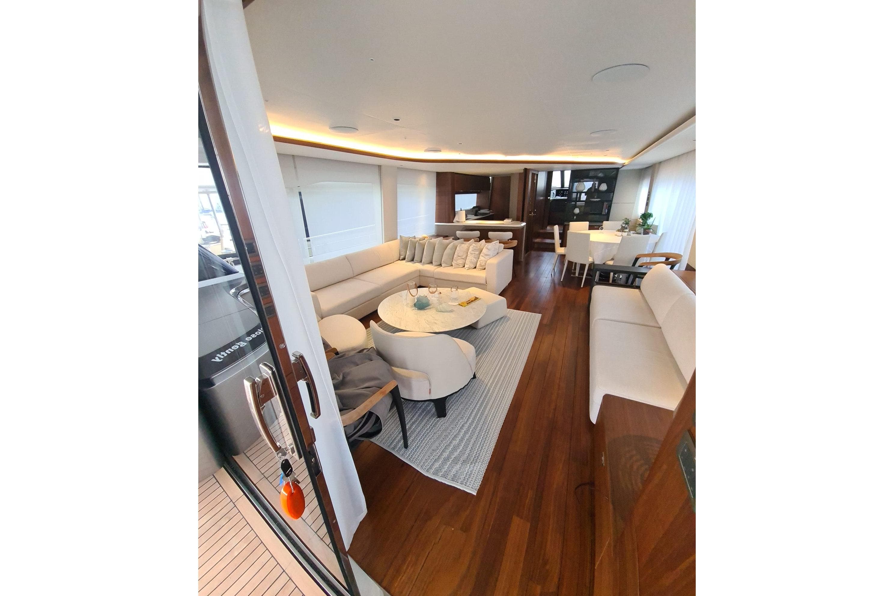 Luxurious interior of 2022 Princess Y85 yacht with elegant seating and dining area.