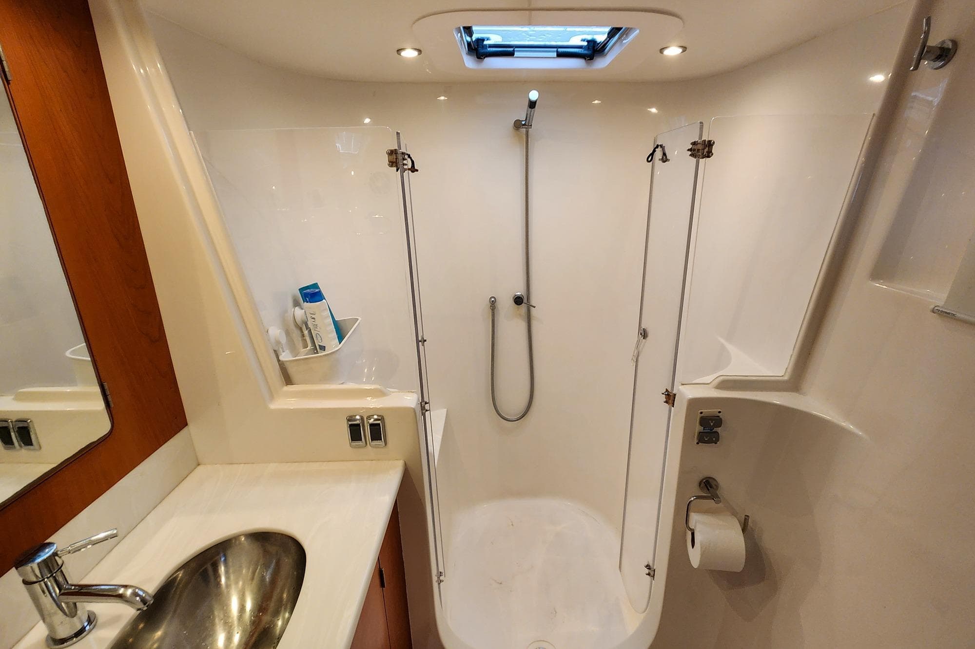 Modern bathroom in 2022 Antares Hybrid yacht with shower and sink.