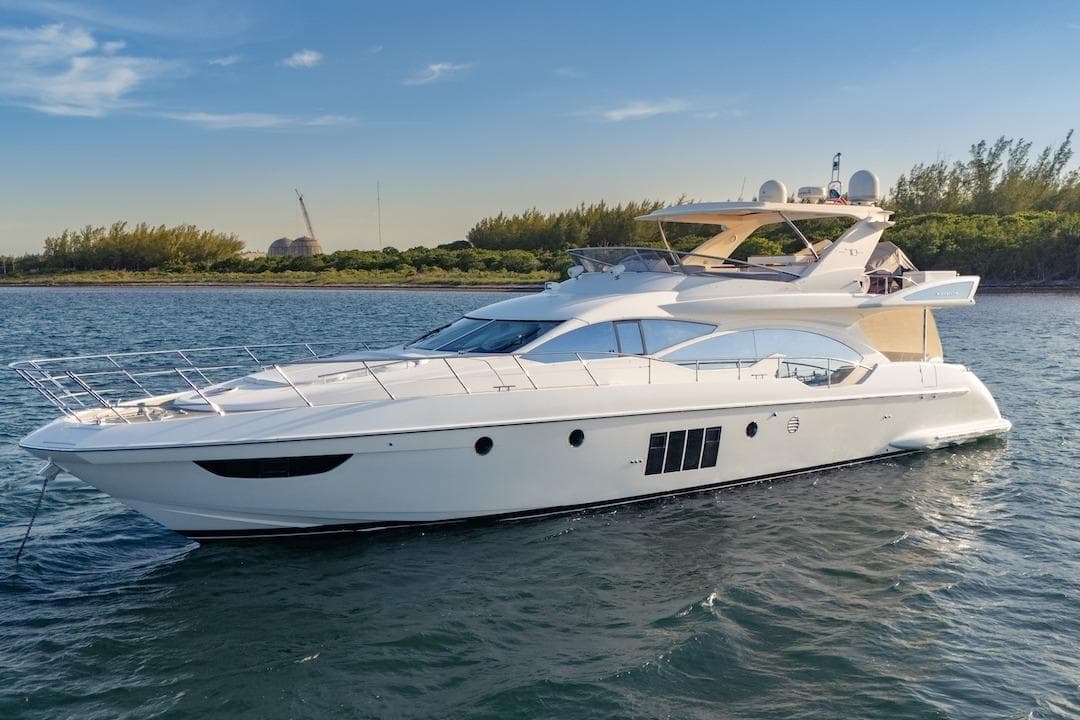 Luxurious 2012 Azimut Evolution yacht cruising on serene waters.