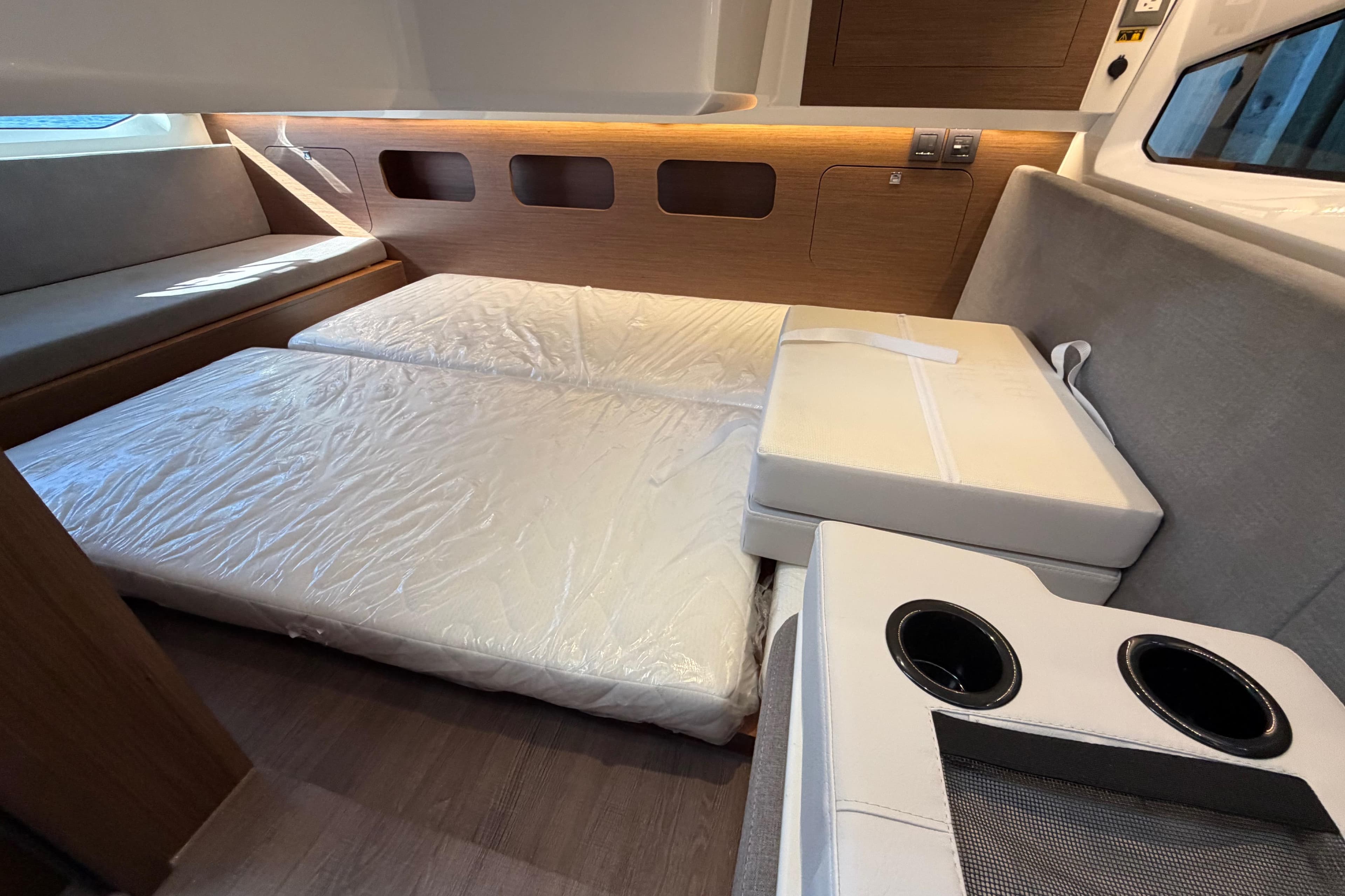 Interior cabin of 2026 Beneteau Antares 11 Fly with convertible seating and modern design.