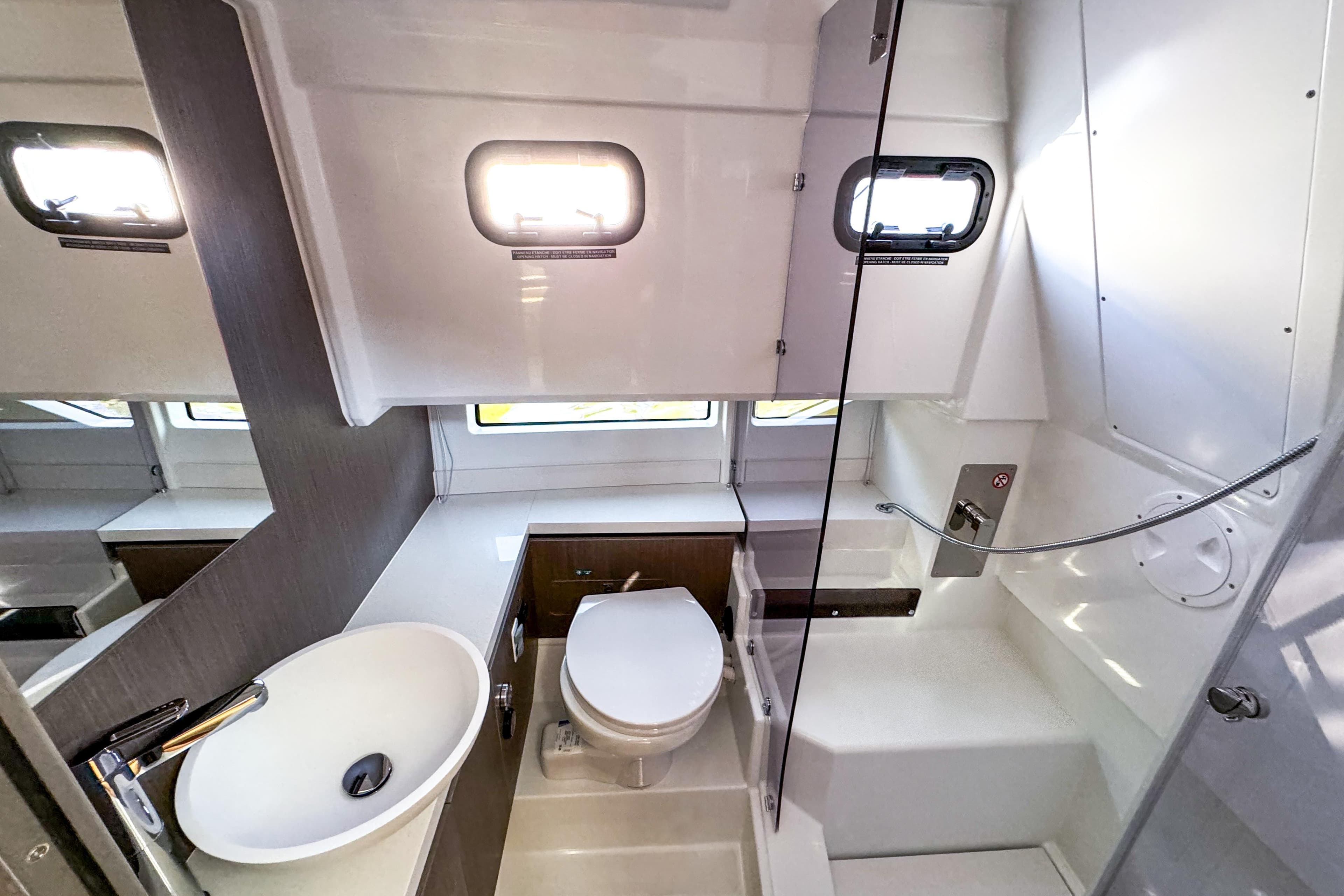 2025 Wellcraft 38 Explorer bathroom with modern fixtures, sink, toilet, and shower area.