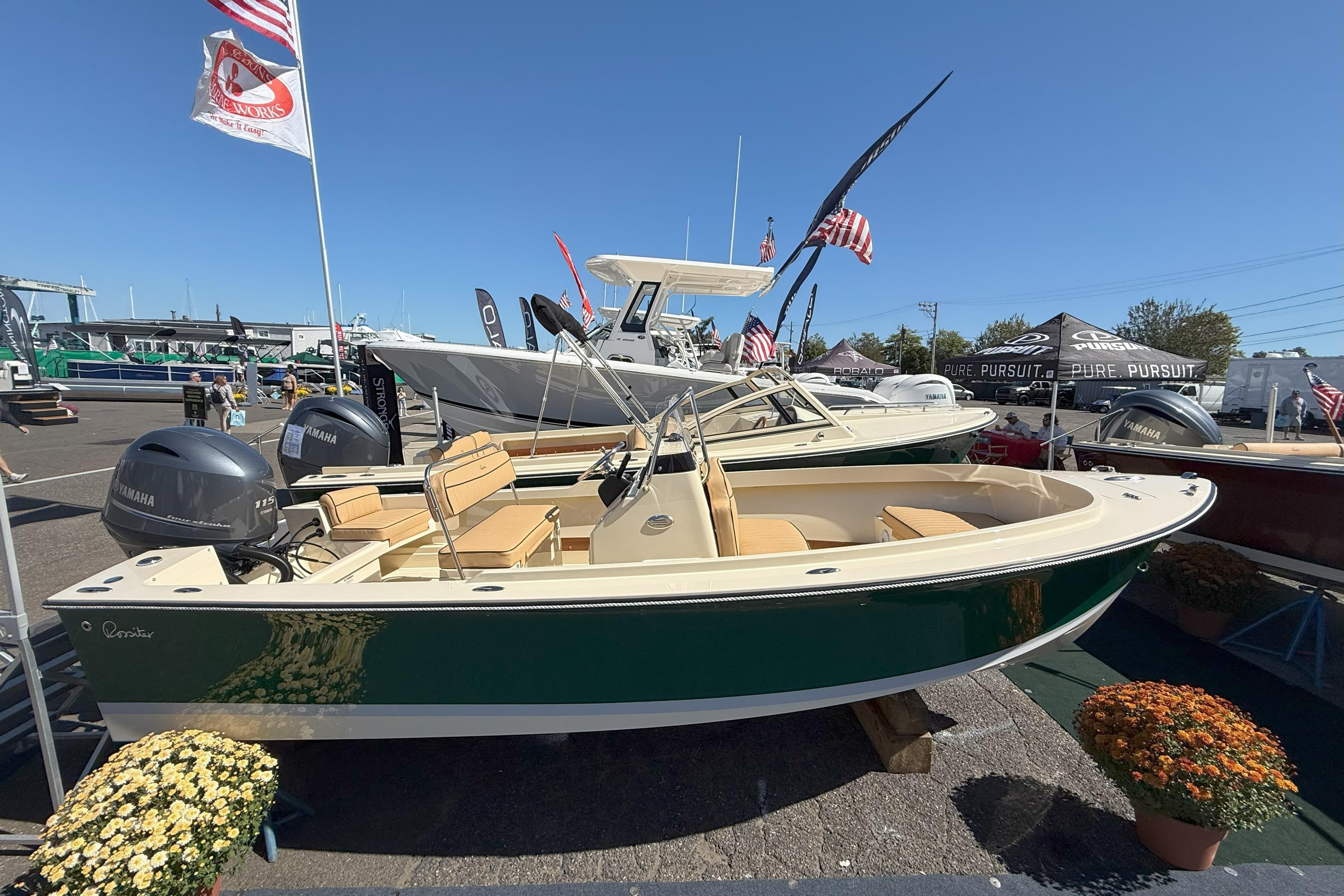 2026 Rossiter 17 CC boat displayed at an outdoor boat show with Yamaha engines.