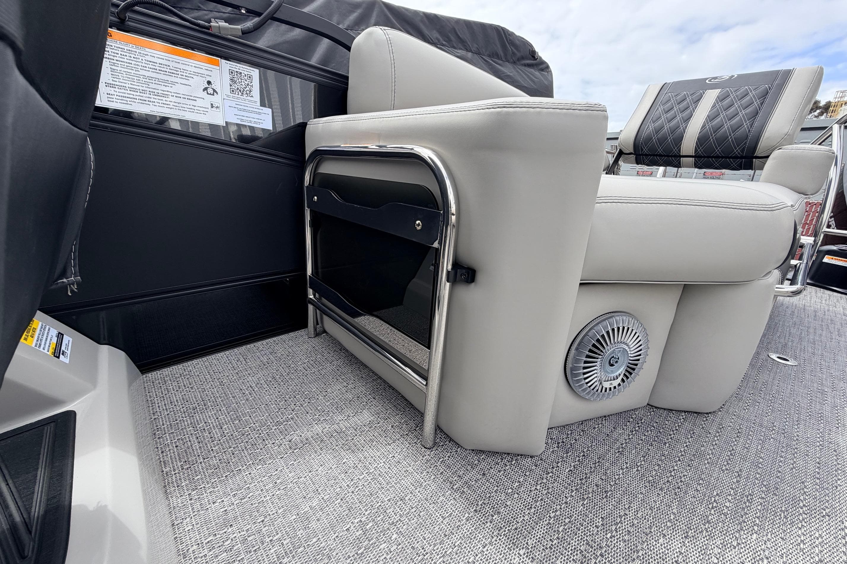 2026 Barletta Lusso 23M boat interior with luxurious seating and speaker detail.