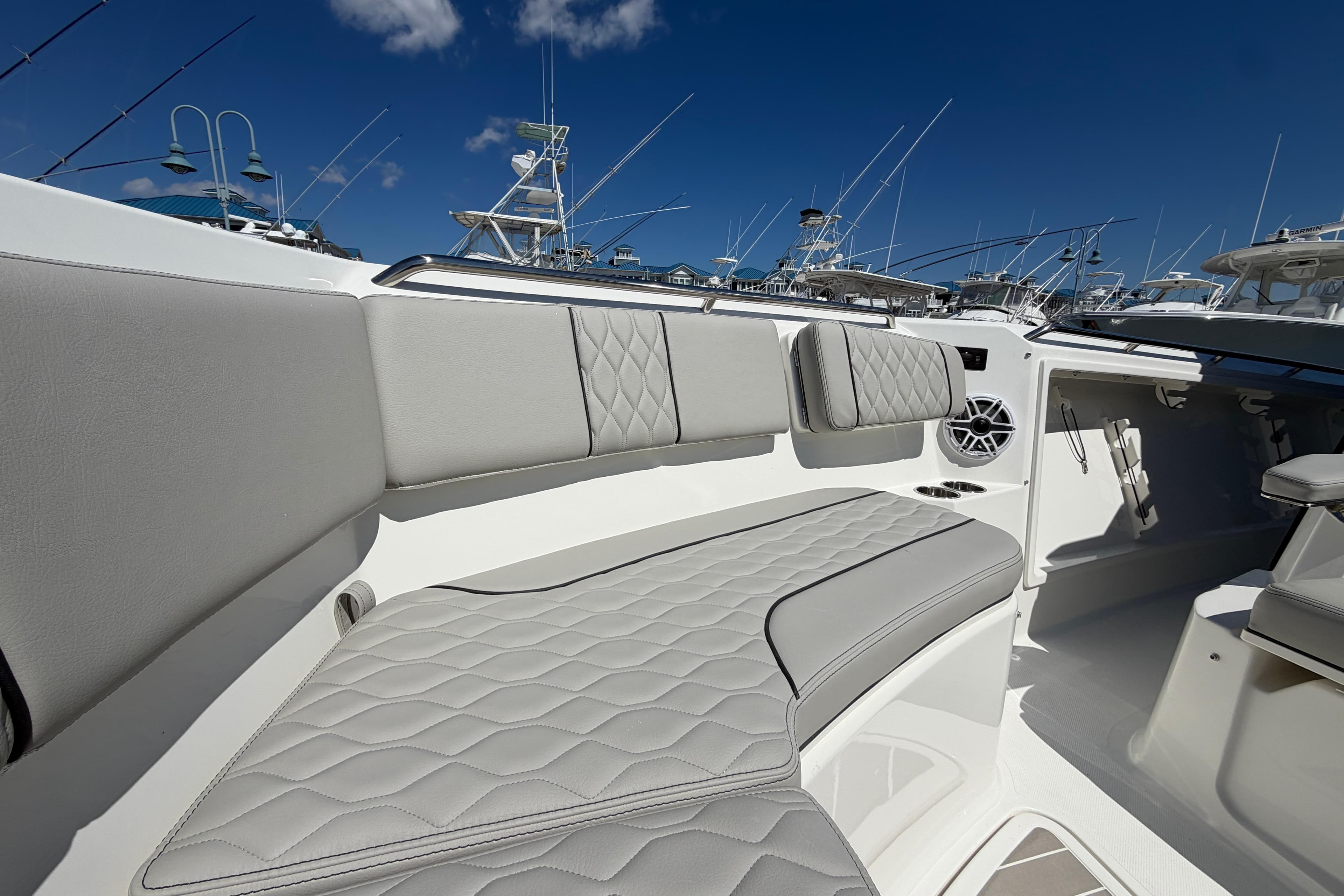 Luxurious seating on the 2026 Pursuit S 358 Sport boat, featuring elegant gray upholstery.