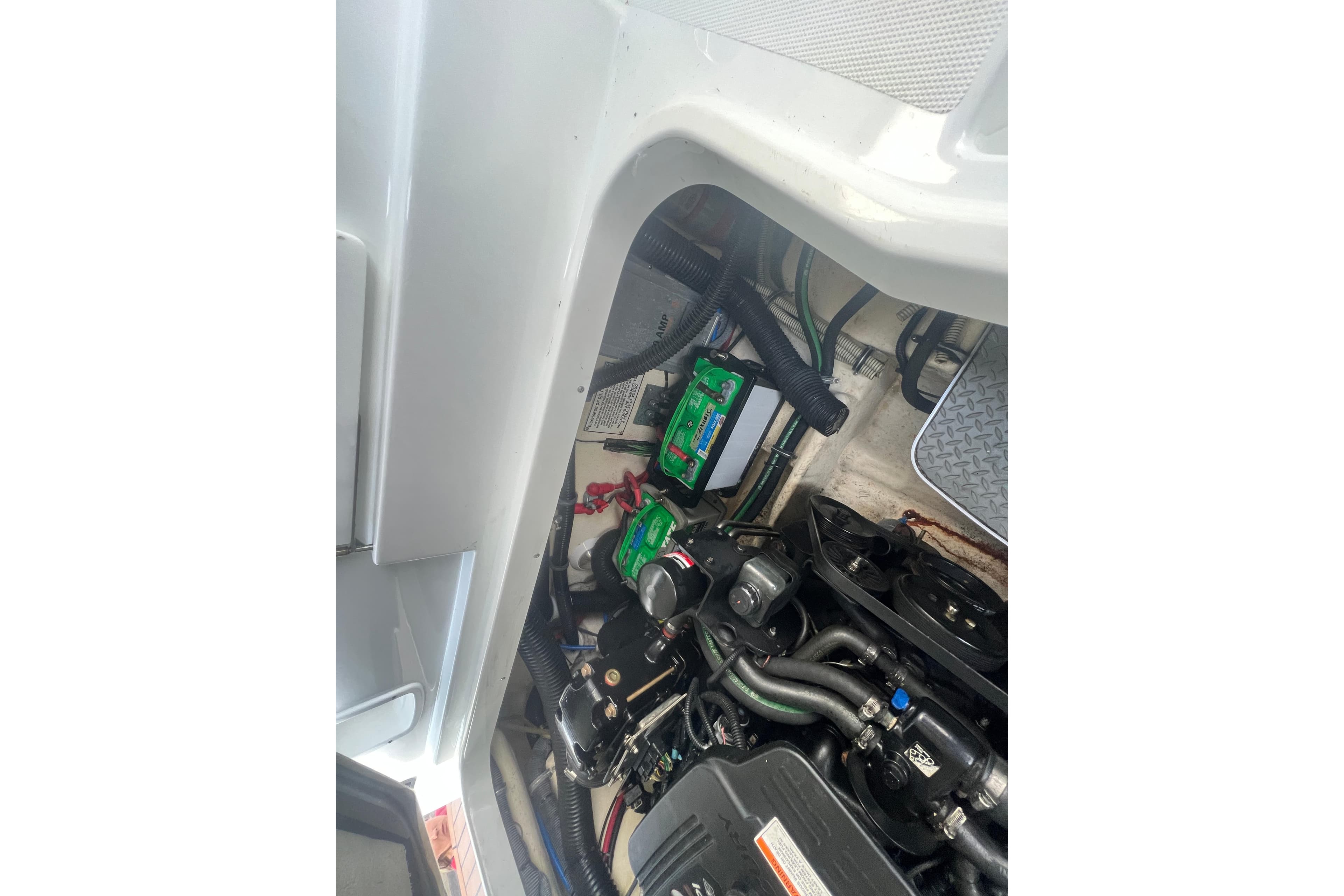 Engine compartment of a 2008 Formula 310 Sun Sport boat, showcasing mechanical components.