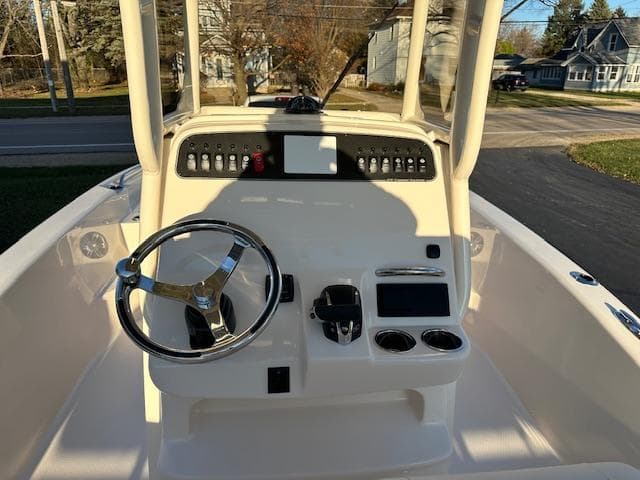 2025 Grady-White 231 Coastal Explorer boat dashboard with steering wheel and controls.
