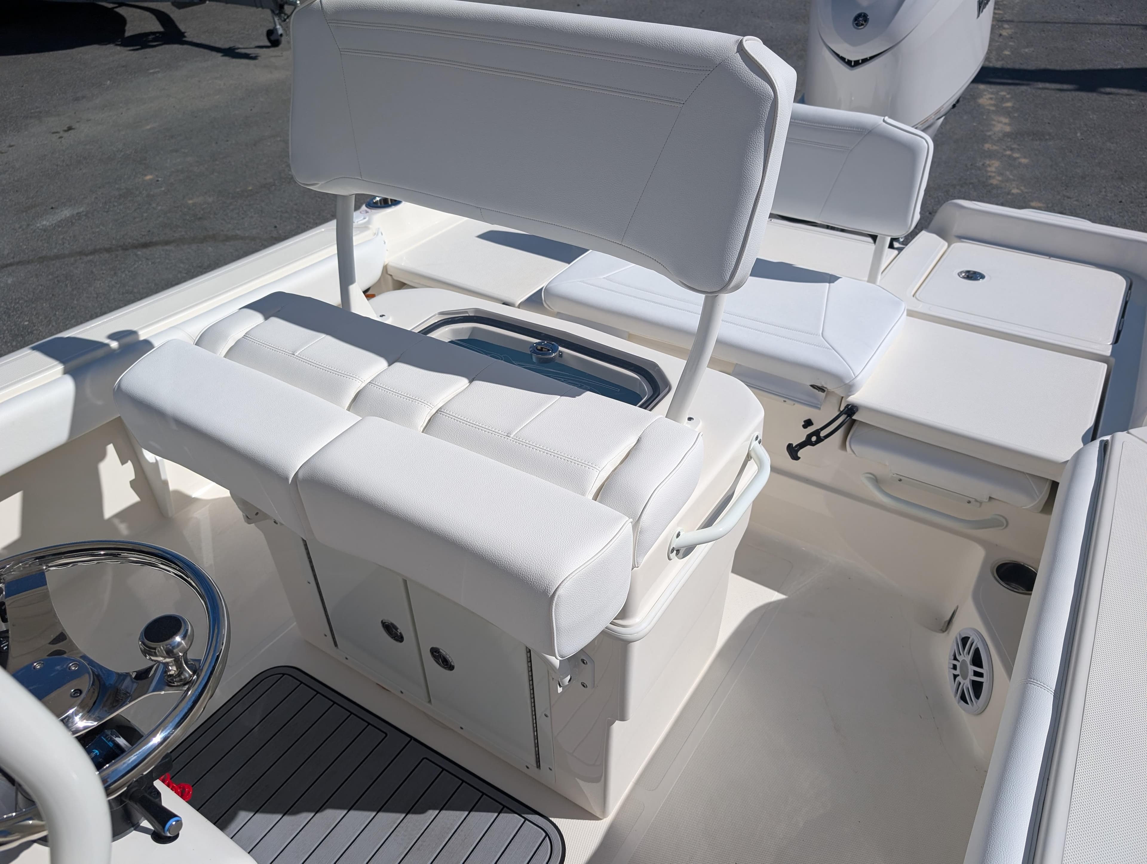 2025 Skeeter SX 2550 Family boat interior with white seating and steering wheel.