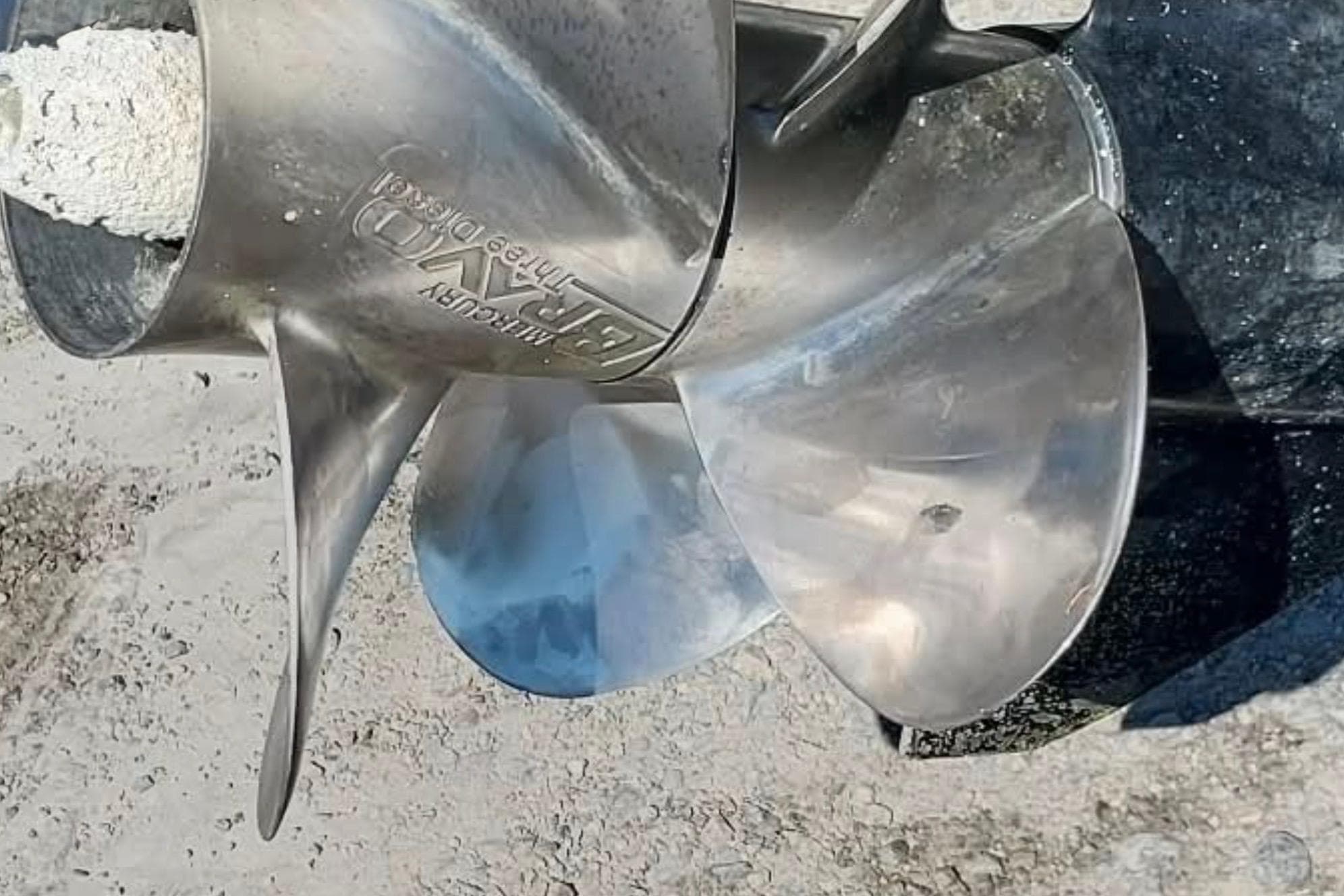 Close-up of a shiny boat propeller on a 2017 Bertram 28 Sport Fisherman.