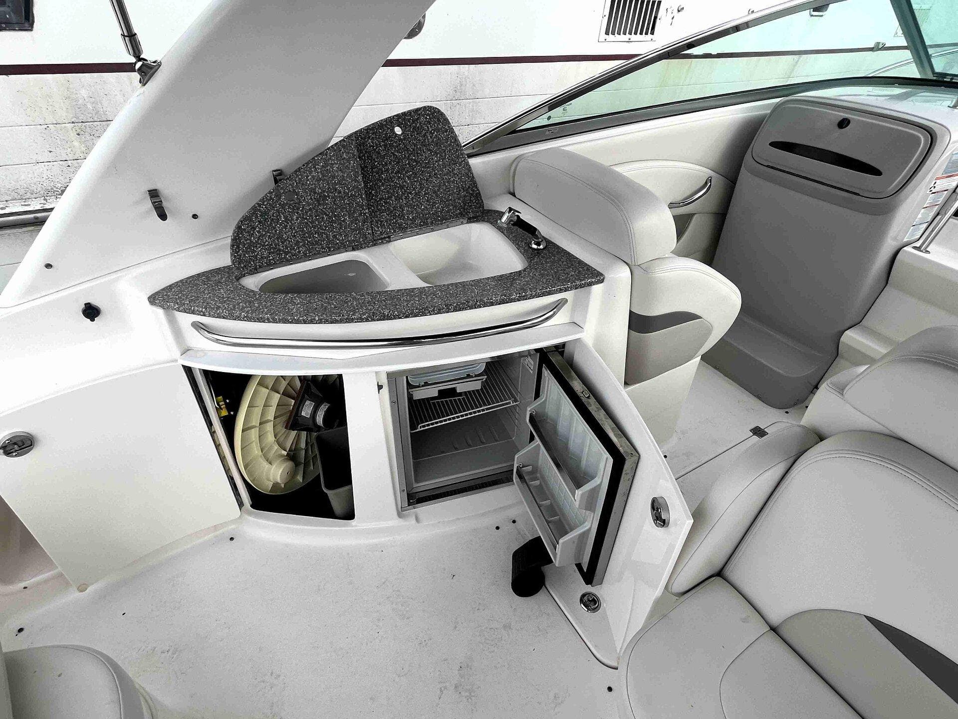 2007 Chaparral 275 SSi boat interior with open storage and seating area.
