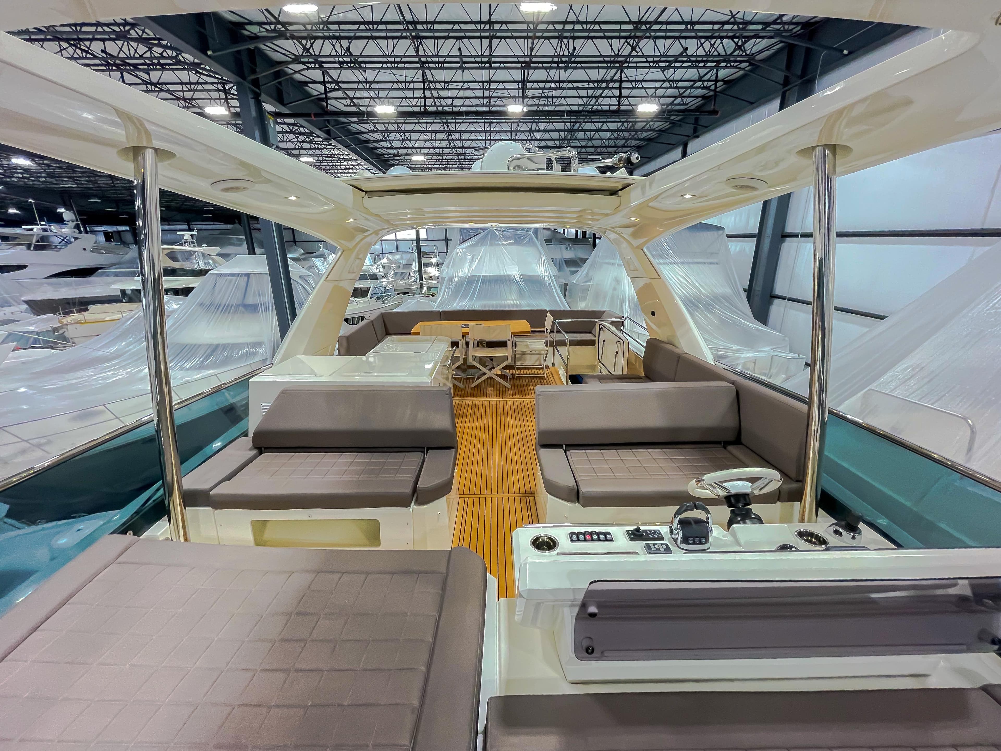 Luxurious 2016 Prestige 680 Flybridge yacht interior with spacious seating and modern design.