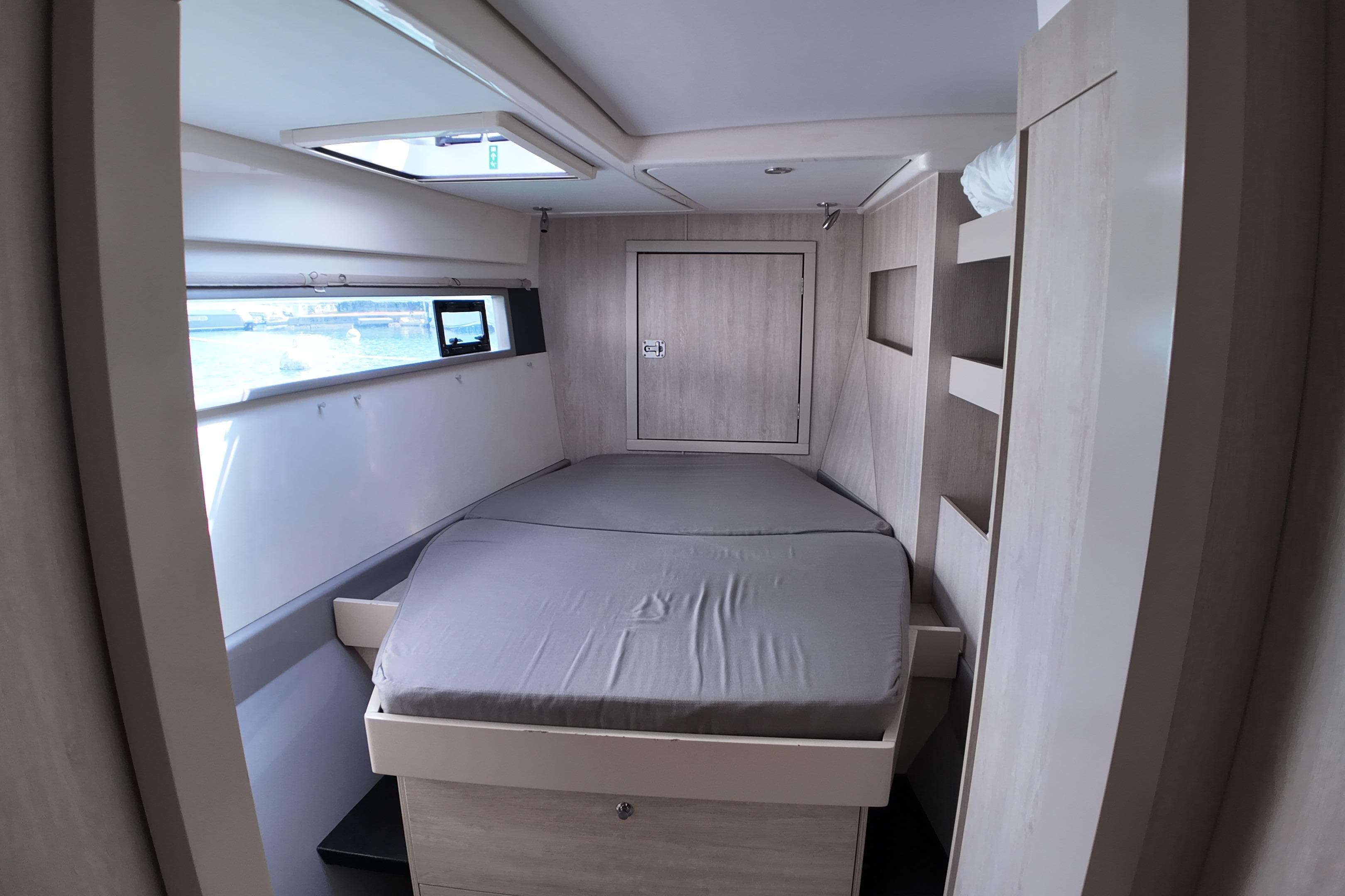 Interior cabin of 2017 Leopard 51 Powercat with bed and window view.