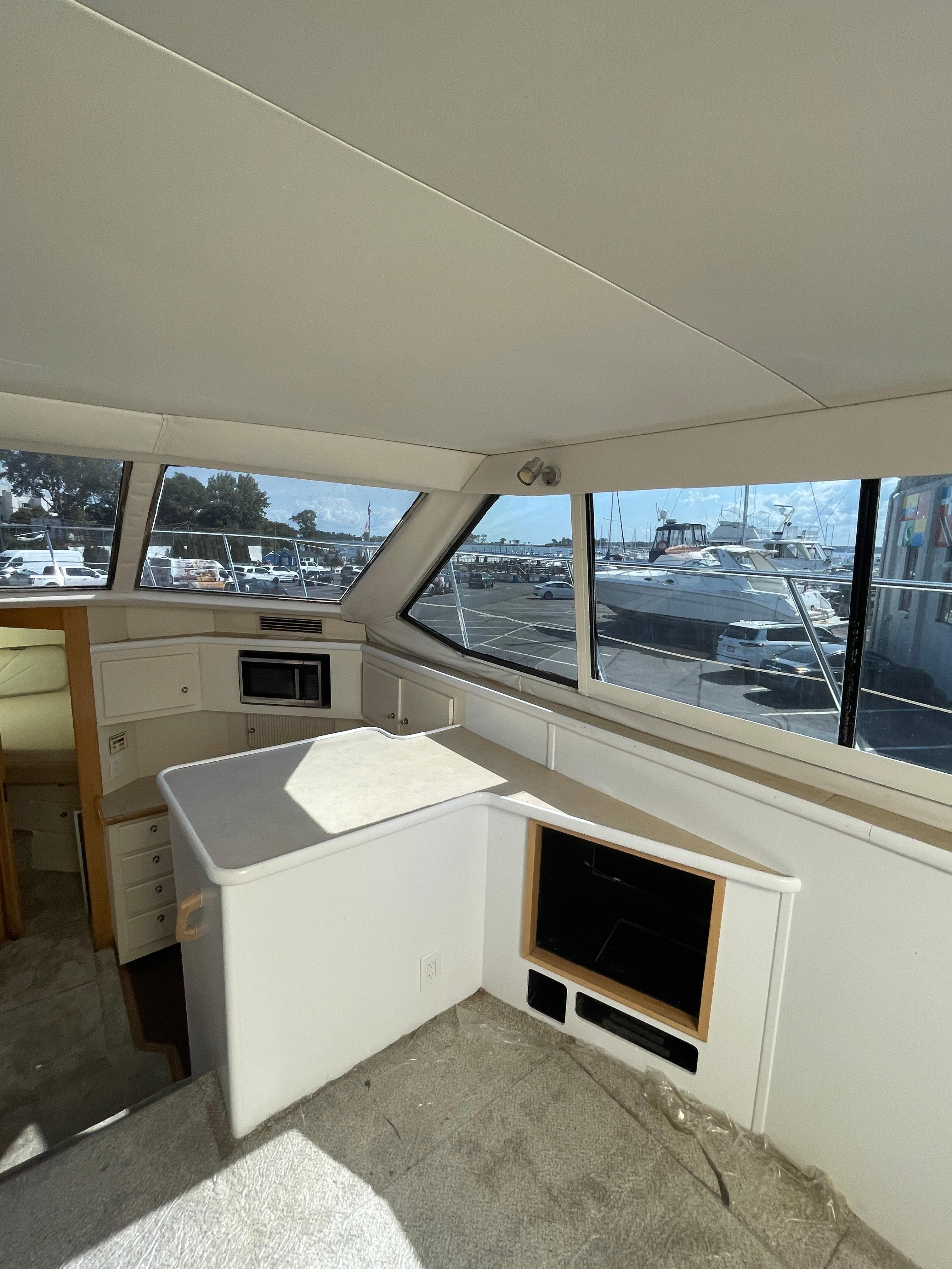 Interior of 1997 Carver 405 yacht with spacious cabin and large windows.