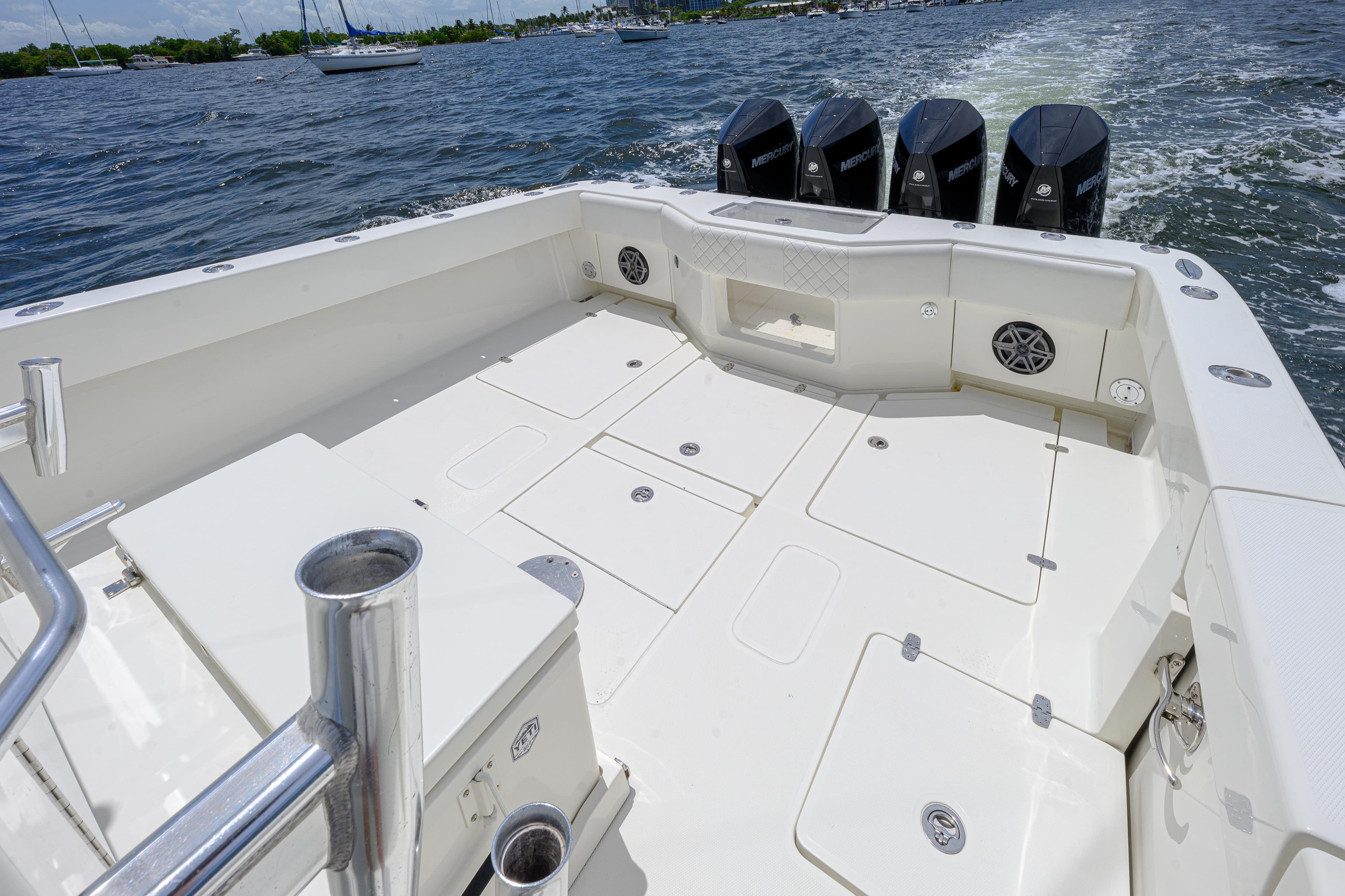 2017 SeaVee 390 boat deck with multiple storage compartments and four outboard motors.