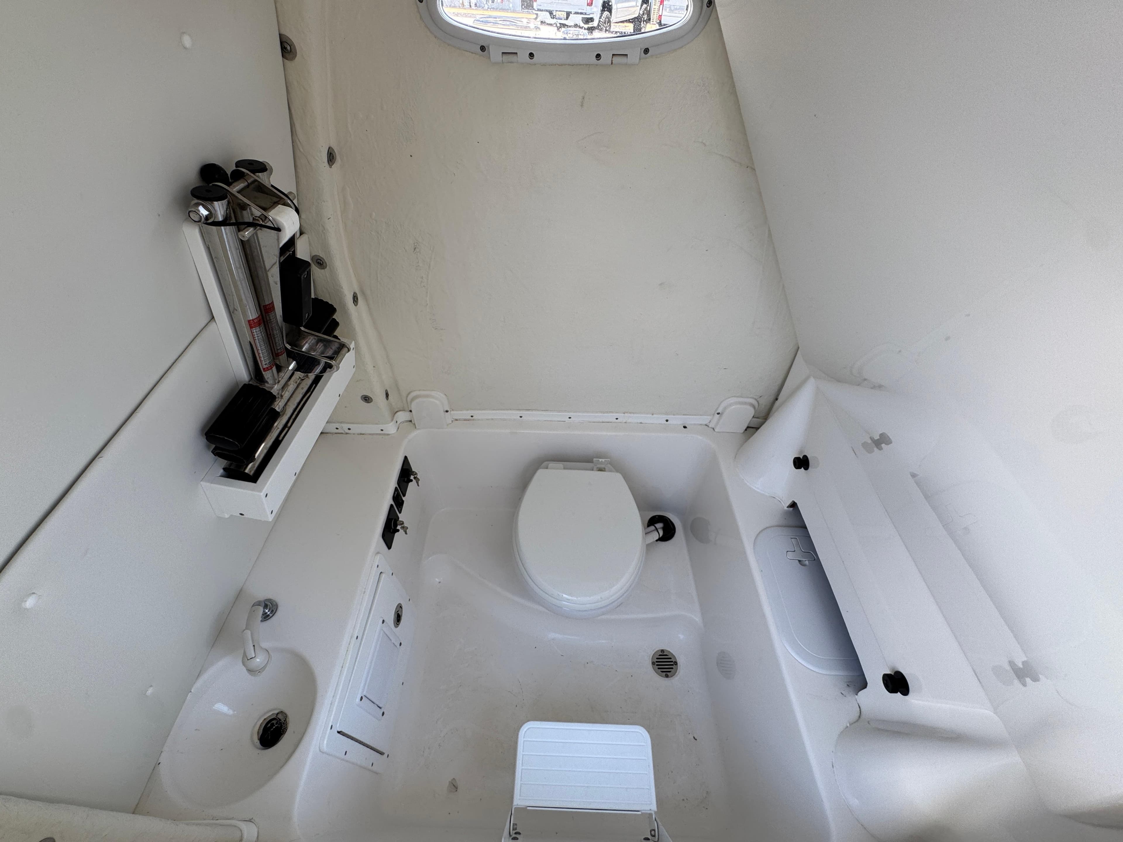 2023 Tidewater 282 CC Adventure Bluewater boat interior with toilet and sink.