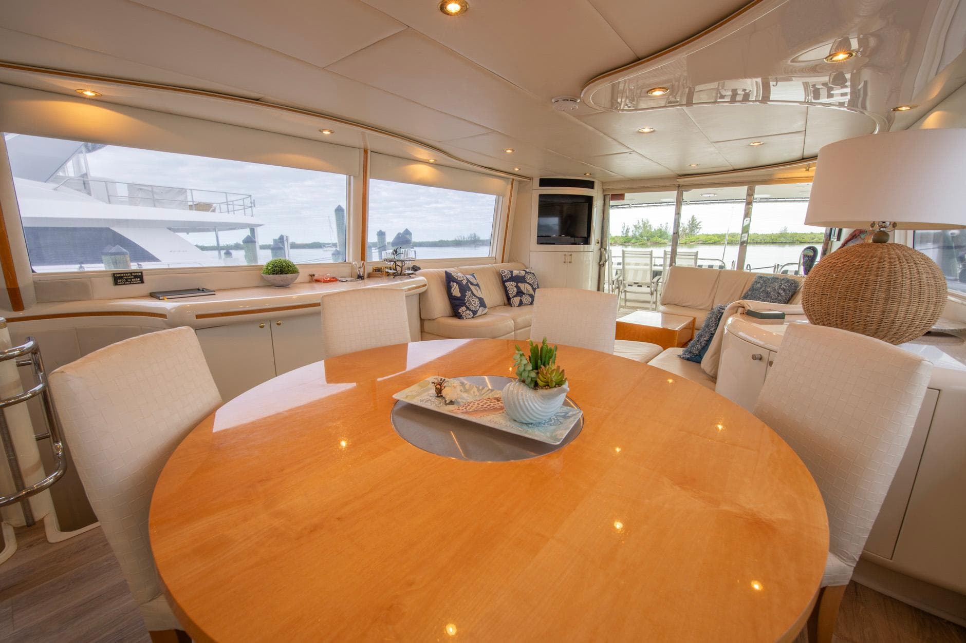 Luxurious interior of 1997 Lazzara 76 Motor Yacht with elegant dining area.