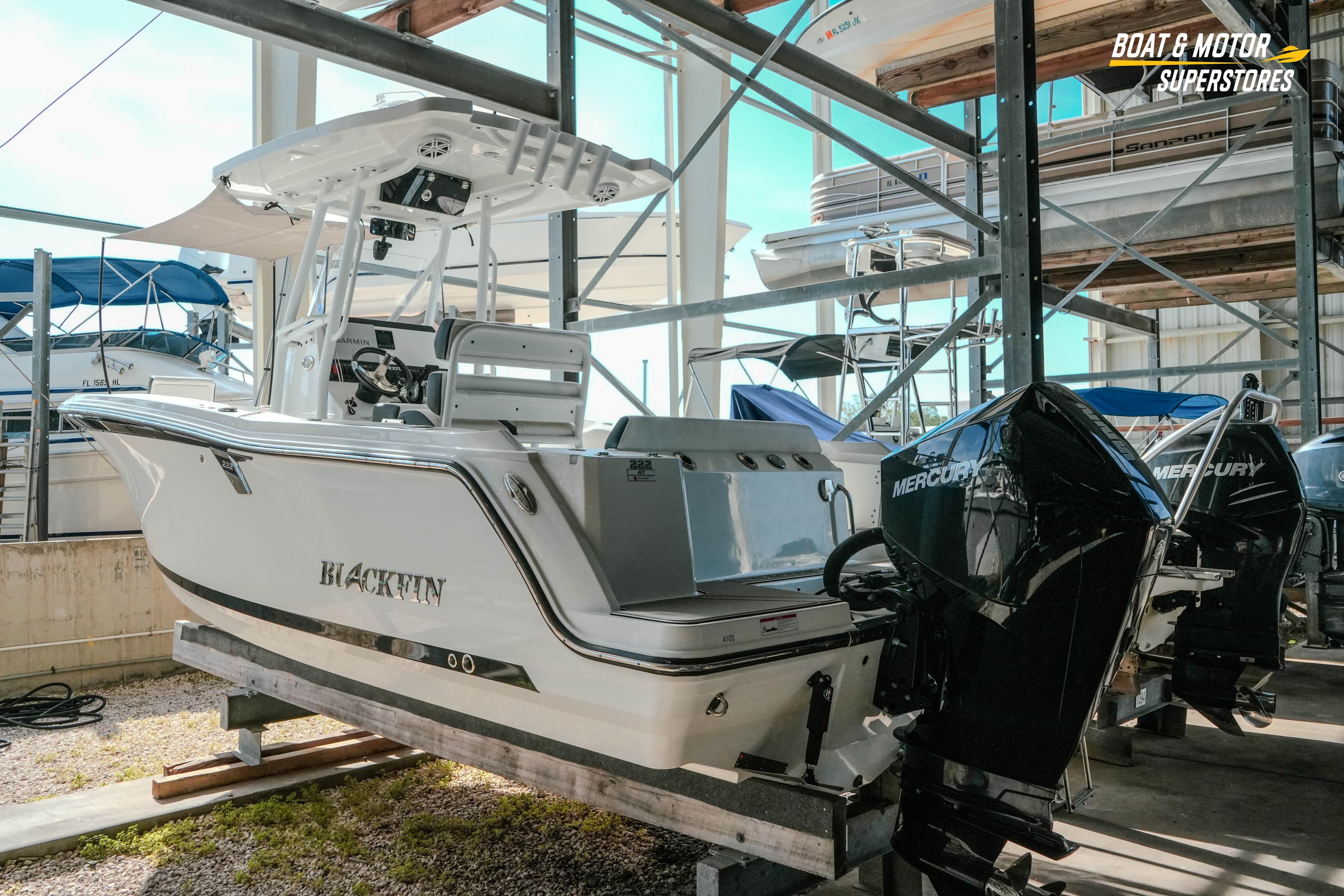 2022 Blackfin 222 CC boat with Mercury engines in storage facility.