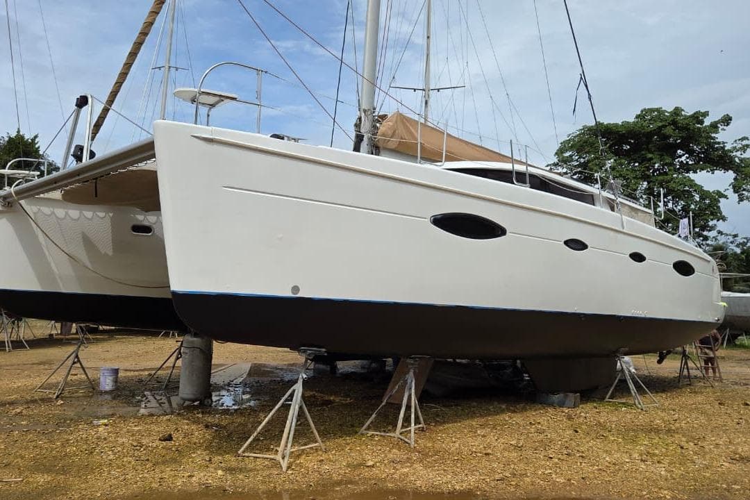 2007 Fountaine Pajot Salina 48 catamaran on dry dock, side view.