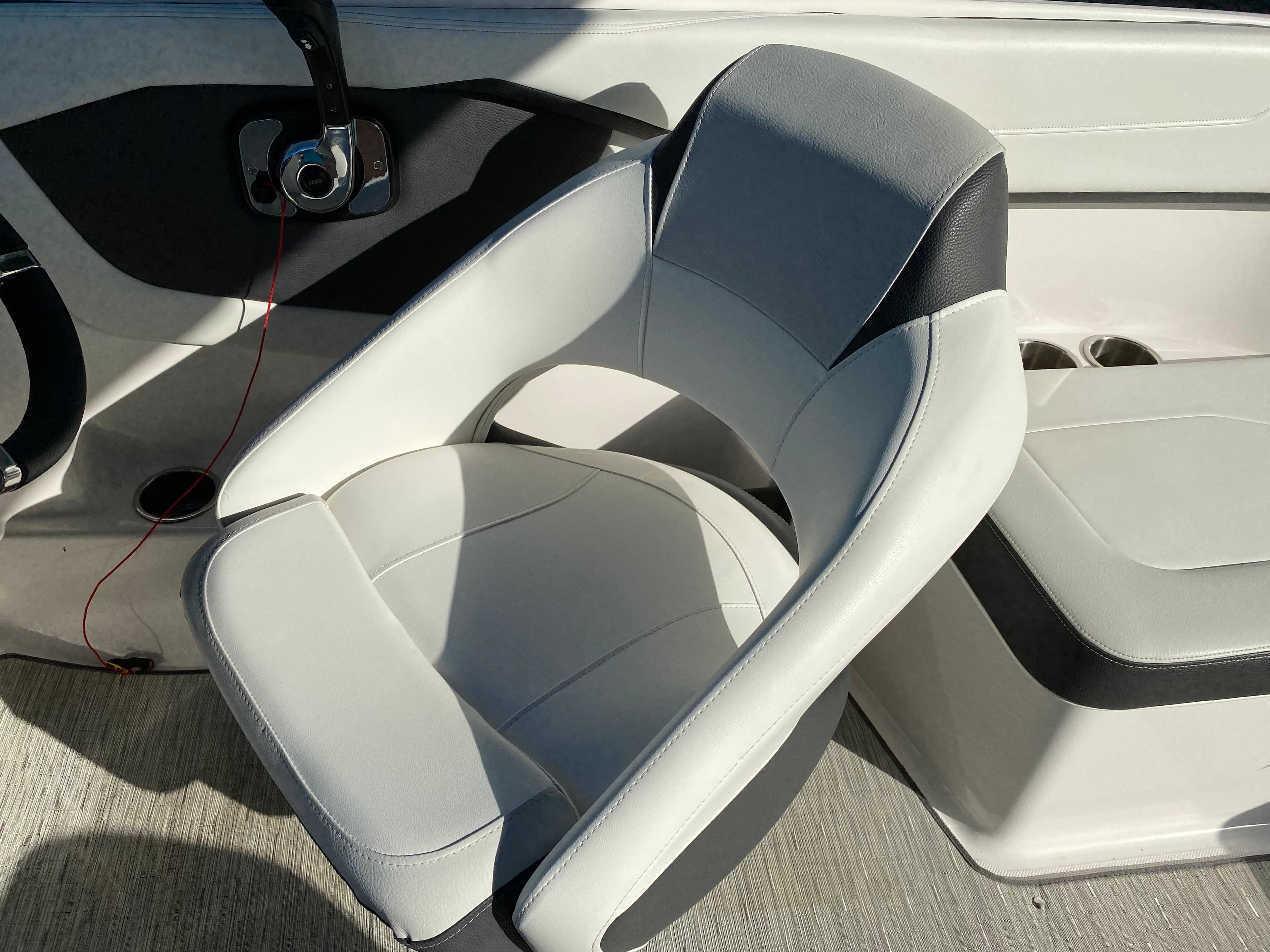 2017 Regal 22 FasDeck boat interior with gray and black seating.