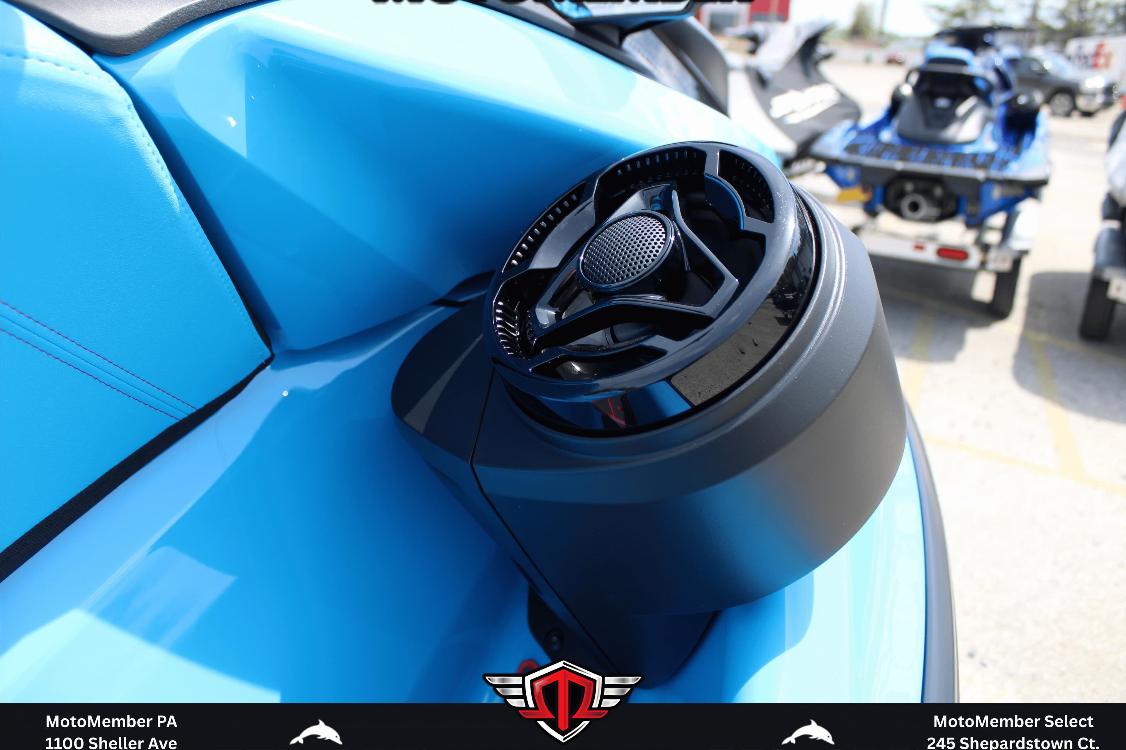 2026 Sea-Doo RXP-X 325 in blue, featuring a sleek speaker system.