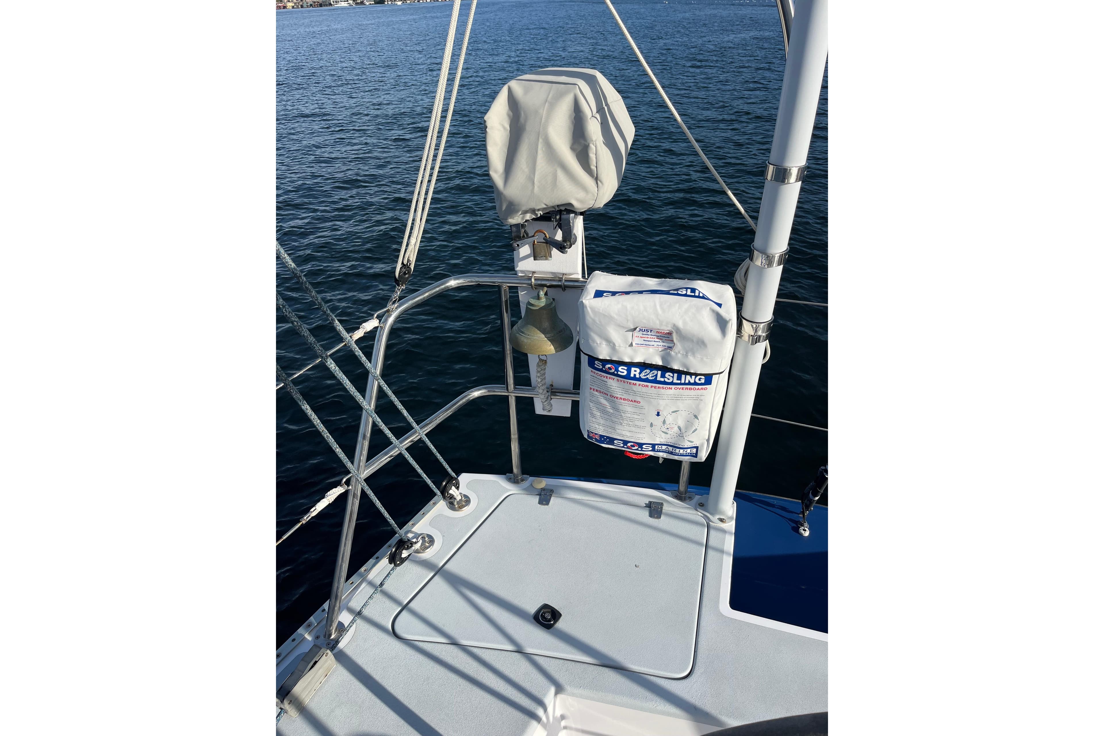 Sailboat deck with safety equipment, Able Apogee 50, 1995 model, on calm water.