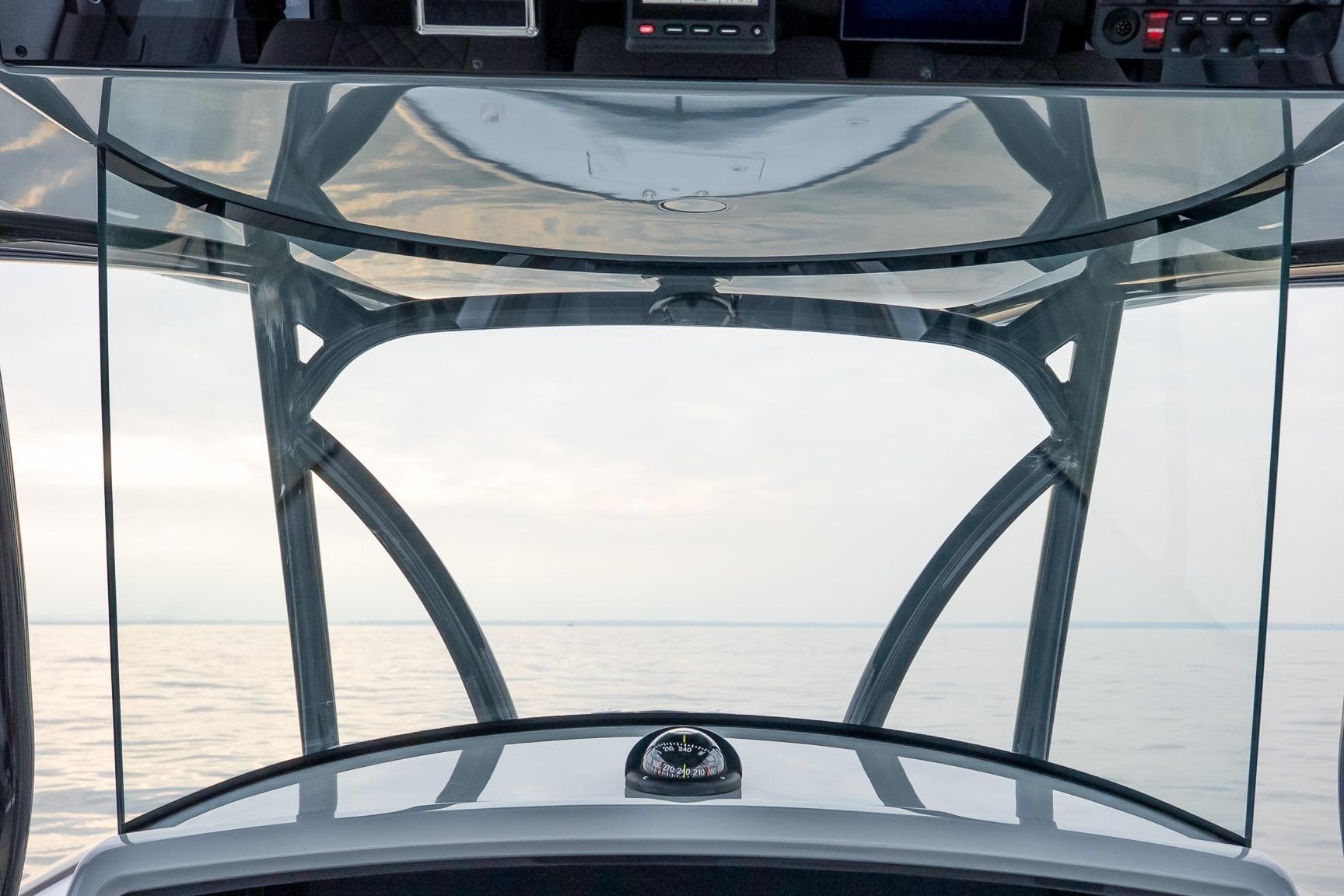 2023 Valhalla Boatworks V-33 helm view with ocean horizon in background.