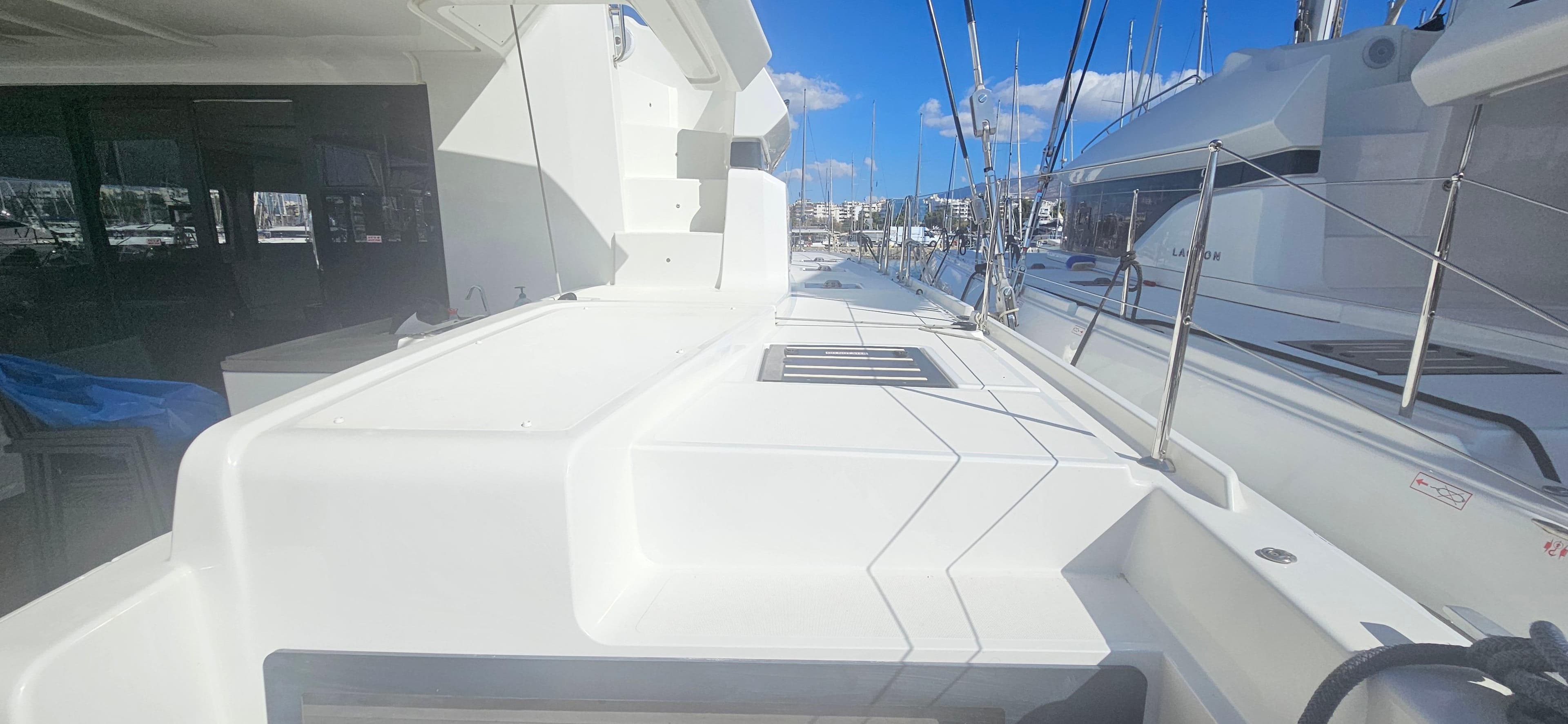 2022 Lagoon 50 yacht deck with sleek design and marina view.