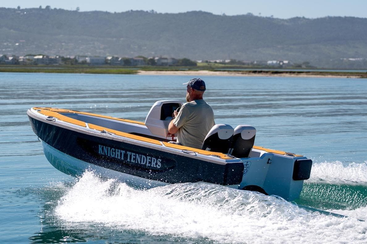 2026 Knight Tender Zerojet Electric Center Console cruising on calm waters.