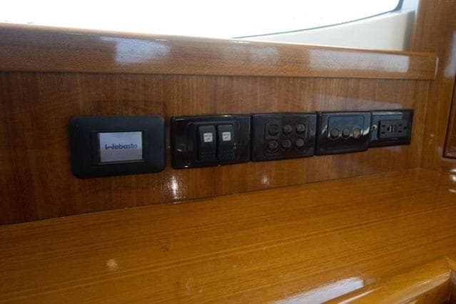 Control panel on 2003 Riviera 4700 Sport Yacht with wood finish.